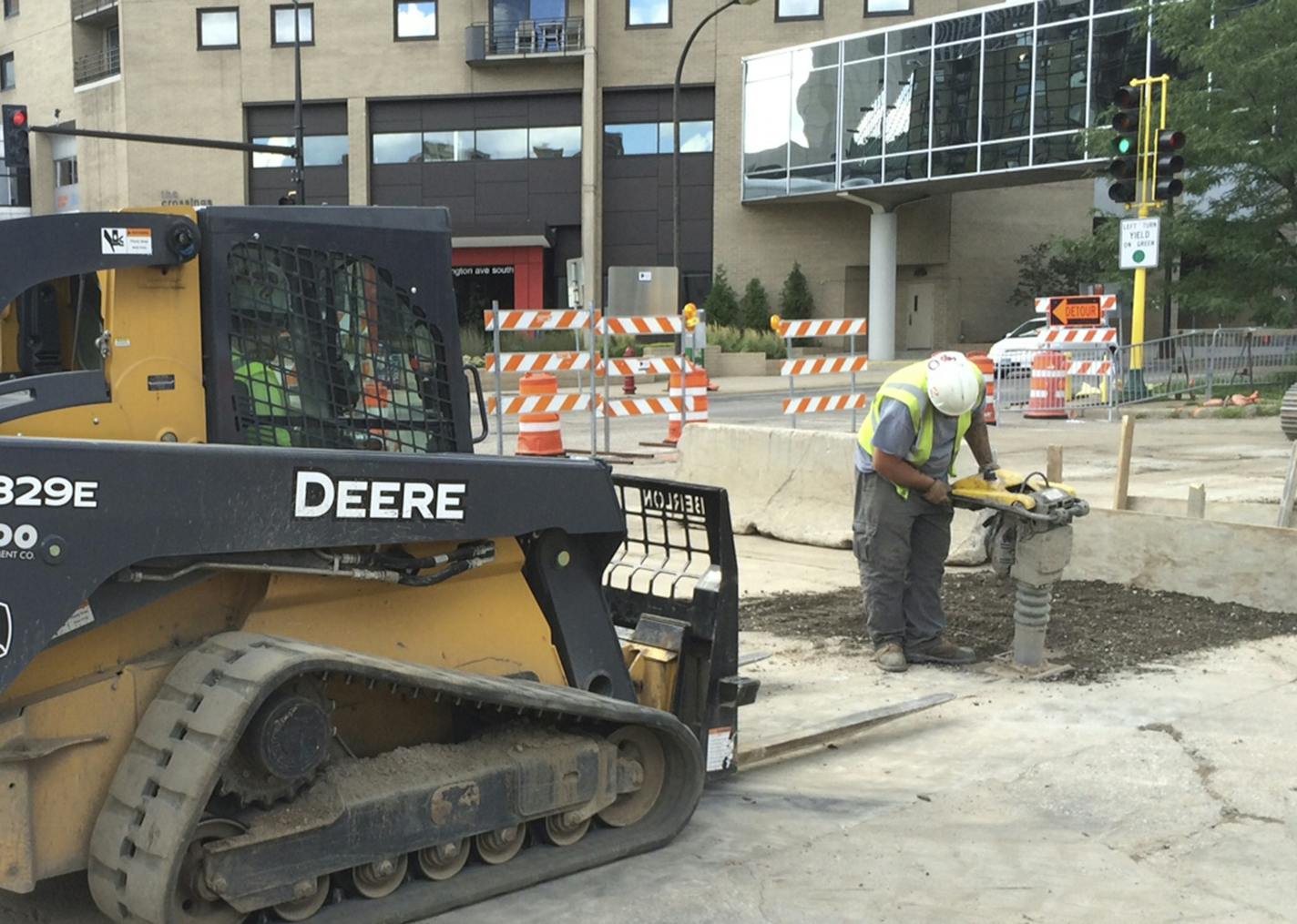 Road crews worked Sunday [Aug. 14] on Washington Av. Near S. 2nd St. in downtown Minneapolis, along a six-block stretch of the street that will be under construction for the next three months, a period including multiple events at the new U.S. Bank Stadium nearby. Photo by Claude Peck