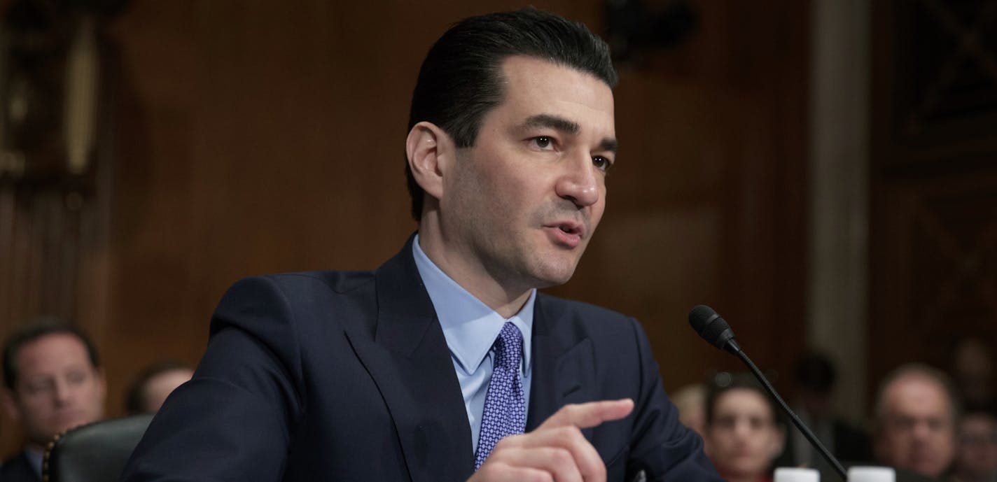 FILE - In this April 5, 2017, file photo, Dr. Scott Gottlieb speaks during his confirmation hearing before a Senate committee, in Washington, as President Donald Trump's nominee to head the Food and Drug Administration. The Food and Drug Administration Commissioner is stepping down after nearly two years leading the agency. Health and Human Services Secretary Alex Azar announced Gottlieb&#x2019;s plan resignation in a statement Tuesday, March 5, 2019. (AP Photo/J. Scott Applewhite, File)