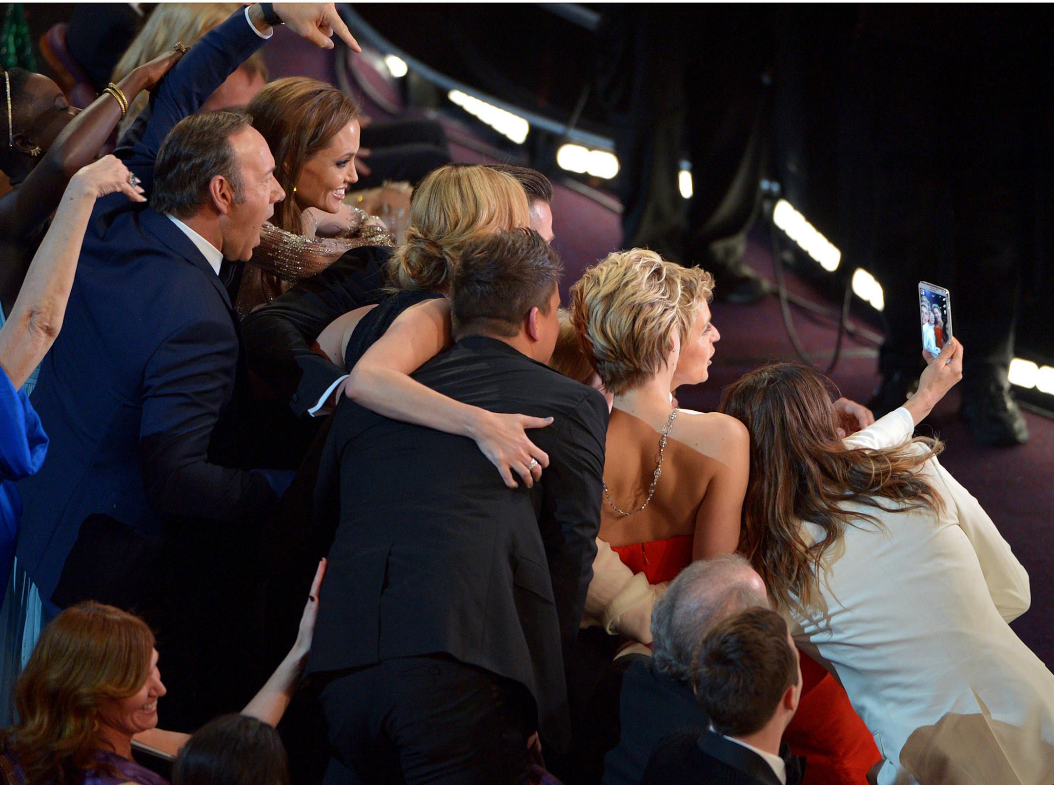 FILE - This March 2, 2014 file photo shows Kevin Spacey, from left, Angelina Jolie, Julia Roberts, Brad Pitt, Jennifer Lawrence, Ellen Degeneres and Jared Leto join other celebrities for a group selfie during the Oscars at the Dolby Theatre in Los Angeles. (Photo by John Shearer/Invision/AP, File)
