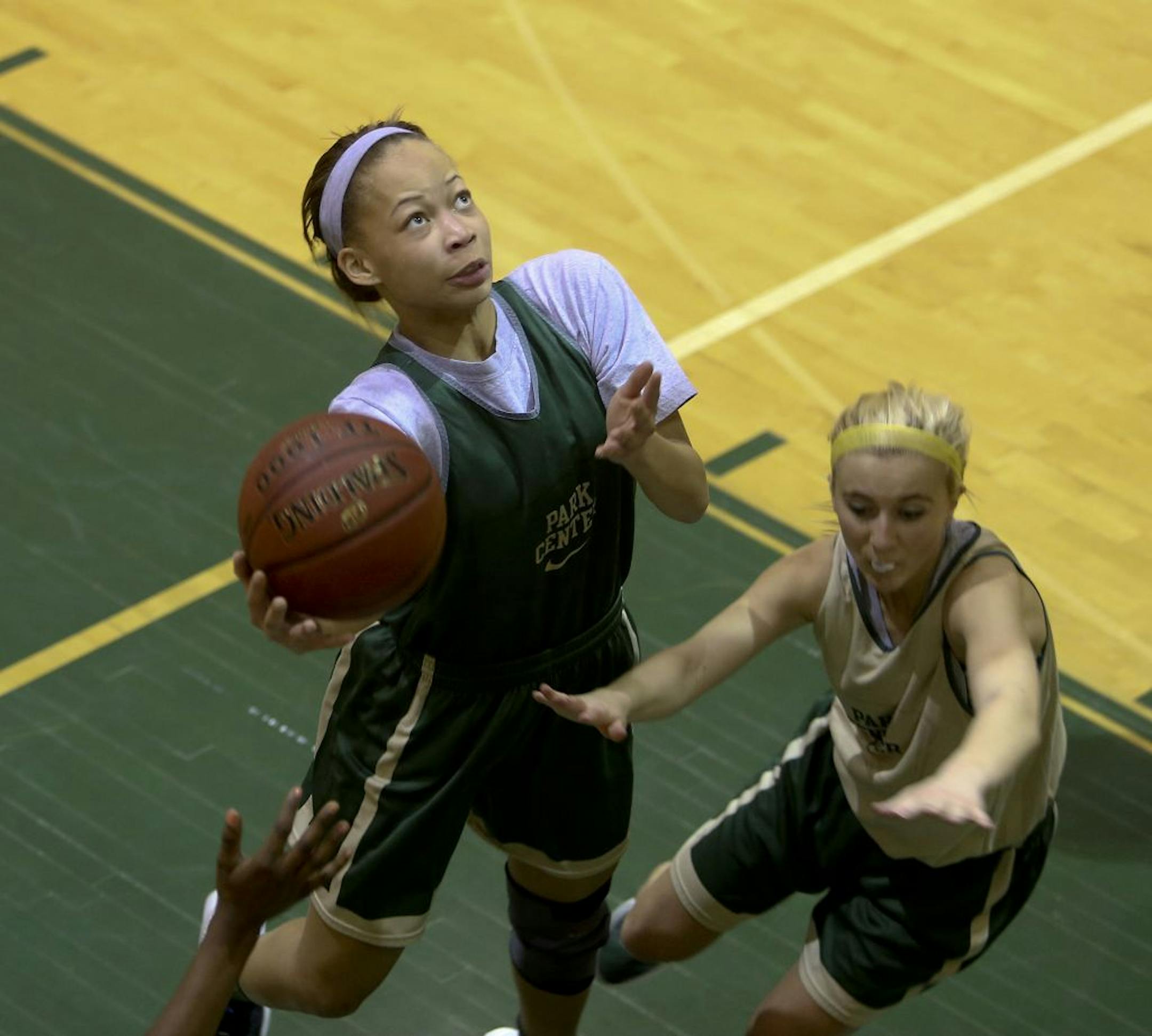 Cayla McMorris, a junior forward and returning all-conference player, went up for a layup against Hannah Schaub, who also was an all-conference selection a year ago, during a recent practice at Park Center High School. Photo by Kyndell Harkness • kharkness@startribune.com