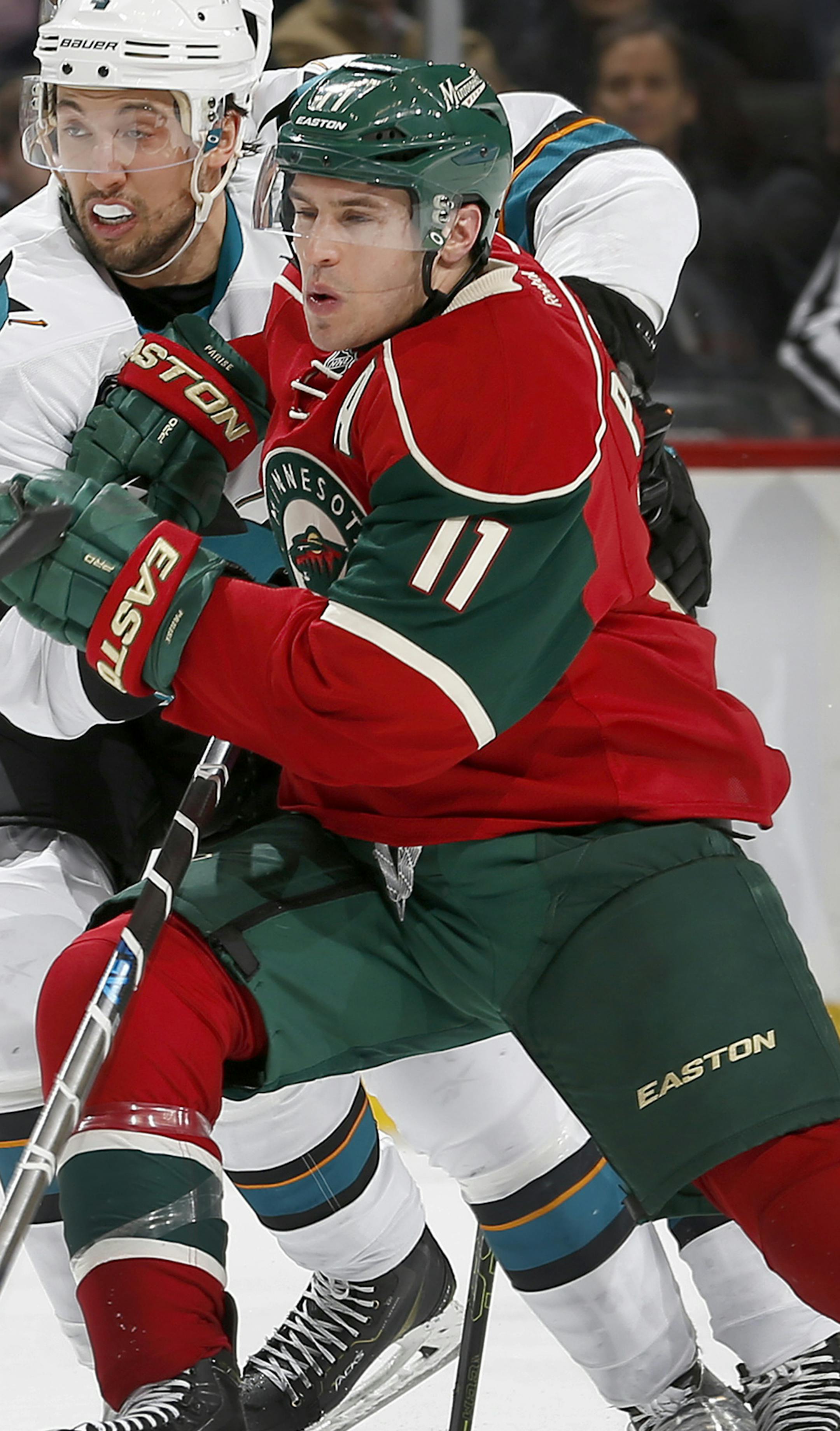 Brenden Dillon (4) and Zach Parise (11) fought for position in the second period. ] CARLOS GONZALEZ cgonzalez@startribune.com - April 5, 2016, St. Paul, MN, Xcel Energy Center, NHL, Hockey, Minnesota Wild vs. San Jose Sharks