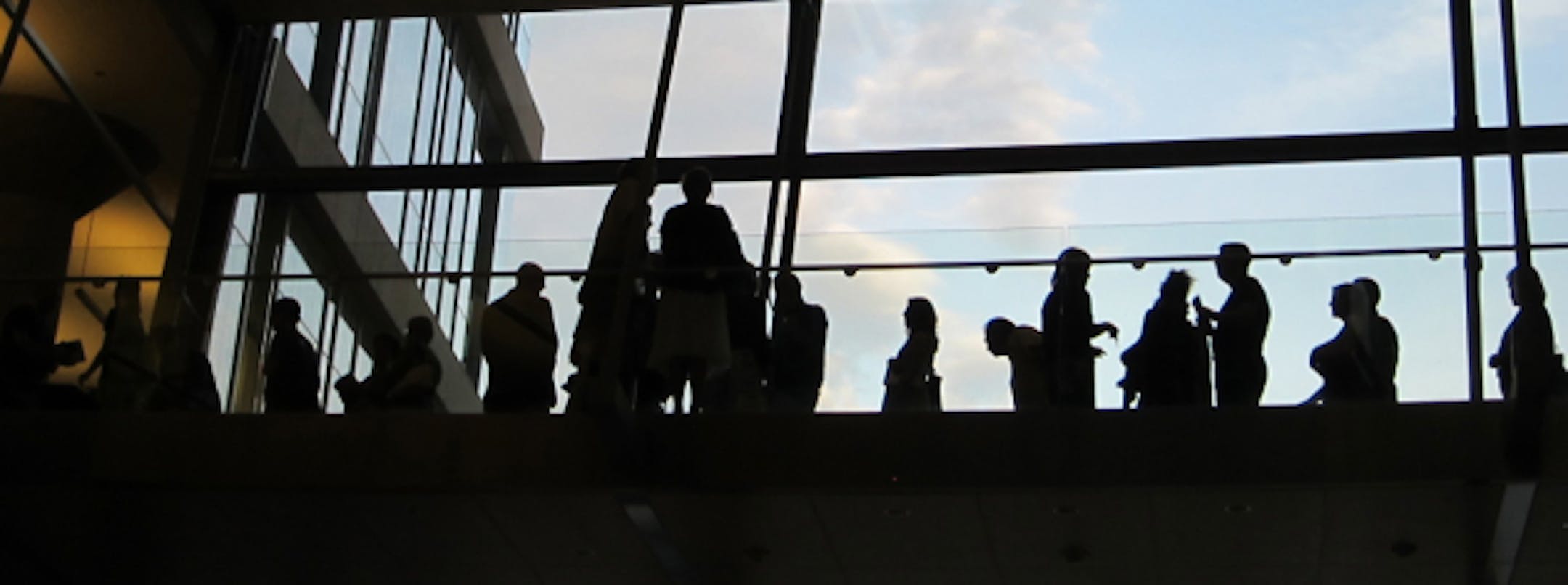 With the great sky behind them, readers line up to get McCann's autograph after his talk.