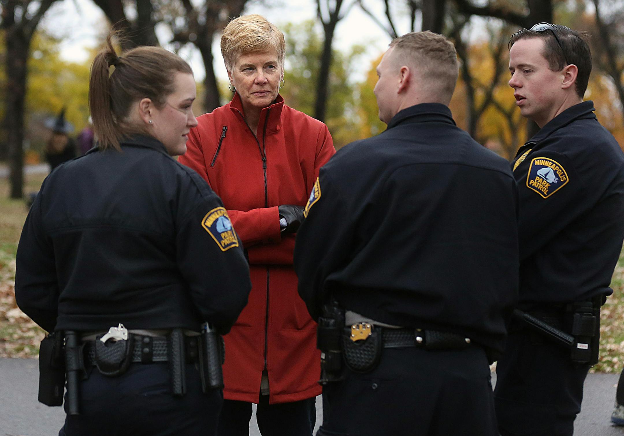 Minneapolis Park Superintendent Jayne Miller mingled with park patrols during a Halloween event at Minnehaha Park. Miller, who has held the job for five years, is facing her biggest challenge: trying to get city voters to sign off on $210 million over 15 years for an overhaul of the park system.