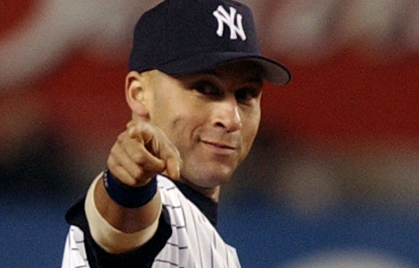 New York Yankees shortstop Derek Jeter points to Aaron Boone in the ninth inning against the Florida Marlins in Game 2 of the World Series in New York, Sunday, Oct. 19, 2003. The Yankees won 6-1. (AP Photo/Charles Krupa) ORG XMIT: NYY147,NYY147