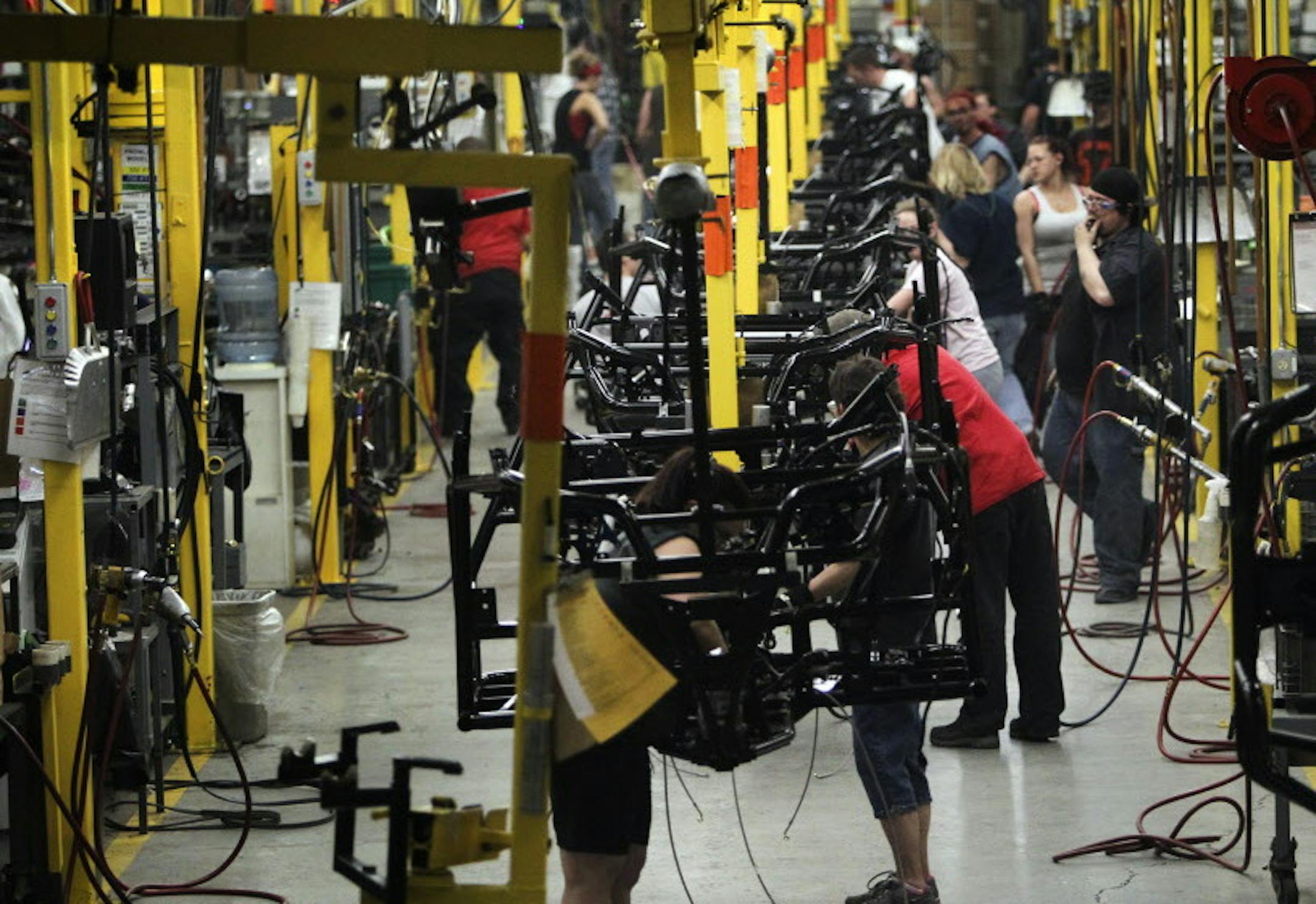 Arctic Cat line workers assemble an Arctic Cat Wildcat ATV at Arctic Cat's muanufacturing facility Wednesday, May 15, 2013 in Thief River Falls, MN. The snowmobile and ATV giant employs about 1,300 workers in Thief River Falls.](DAVID JOLES/STARTRIBUNE) djoles@startribune Pennington County is an island of growth in a sea of economic contraction in northwest Minnesota. Since 2000, job growth in the county has quadrupled population growth, making it an anomaly both statewide and in the northwest p