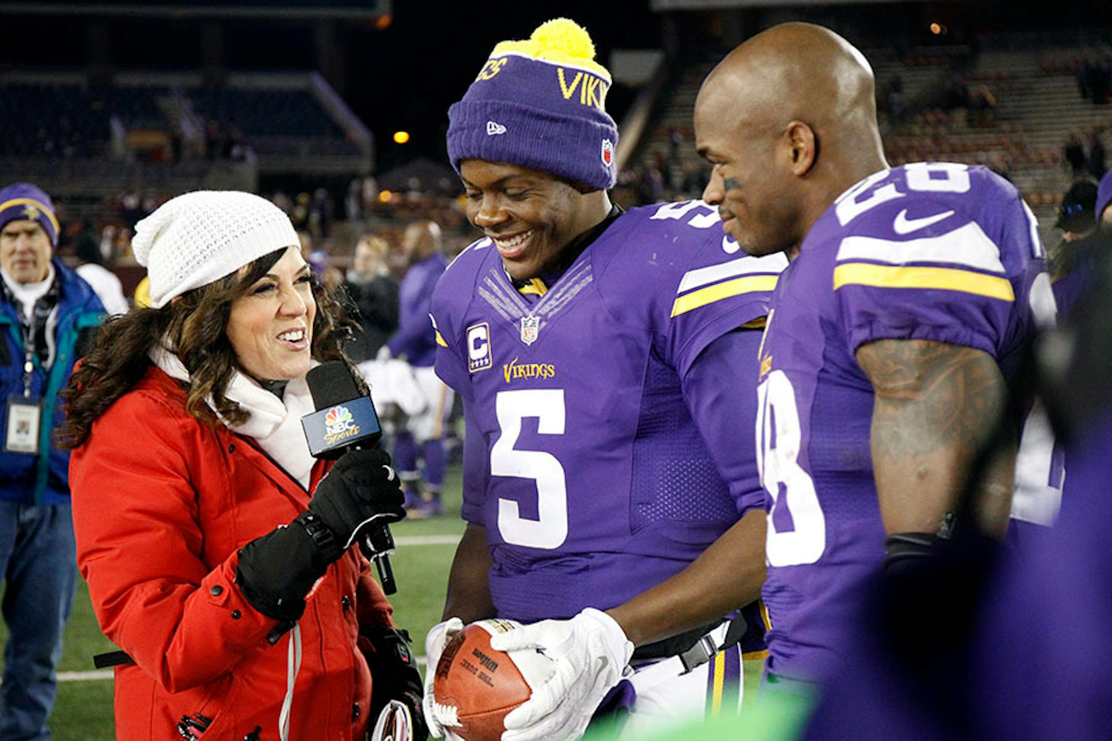 Michele Tafoya interviews Minnesota Vikings quarterback Teddy Bridgewater (5) and Minnesota Vikings running back Adrian Peterson (28) after an NFL football game against the New York Giants, Sunday, Dec. 27, 2015, in Minneapolis. The Vikings won 49-17.