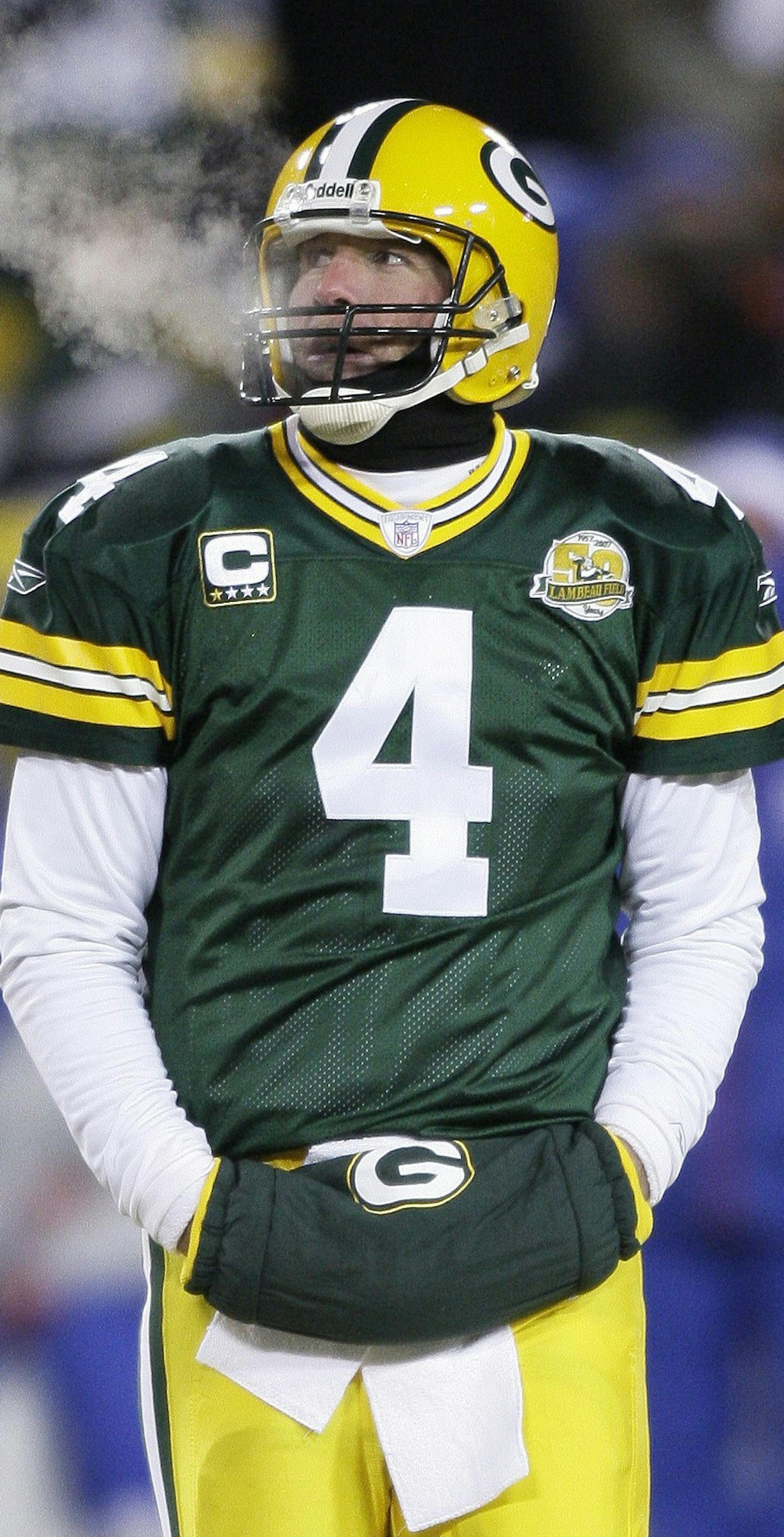 ** FOR USE AS DESIRED WITH YEAR END--FILE **In This Jan. 20, 2008 file photo, Green Bay Packers quarterback Brett Favre looks on during the NFC Championship football game against the New York Giants in Green Bay, Wis. (AP Photo/David J. Phillip/FILE) ORG XMIT: MIN2015111617253064