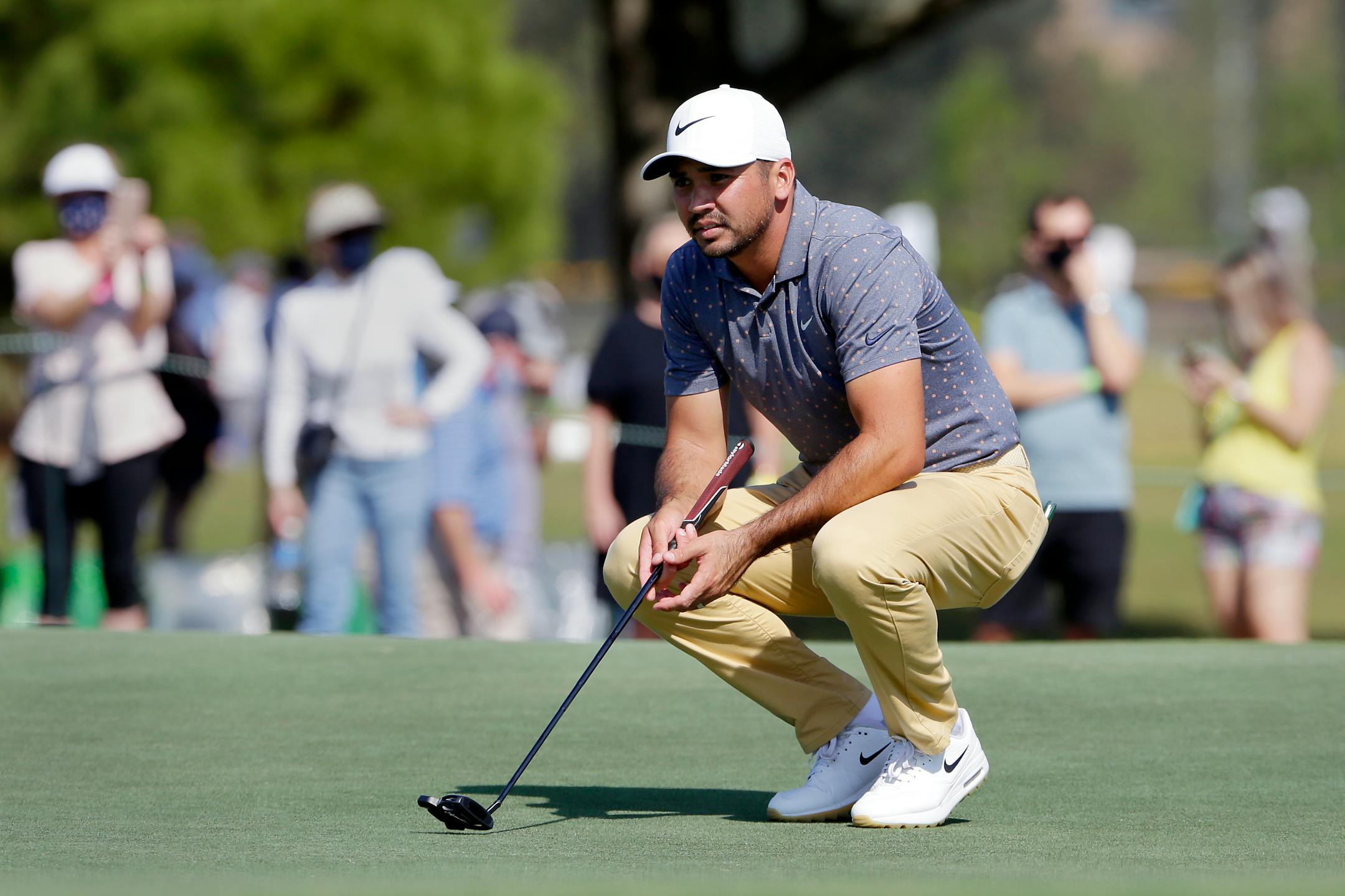 Jason Day checks the green on the 18th hole during the second round of the Houston Open.