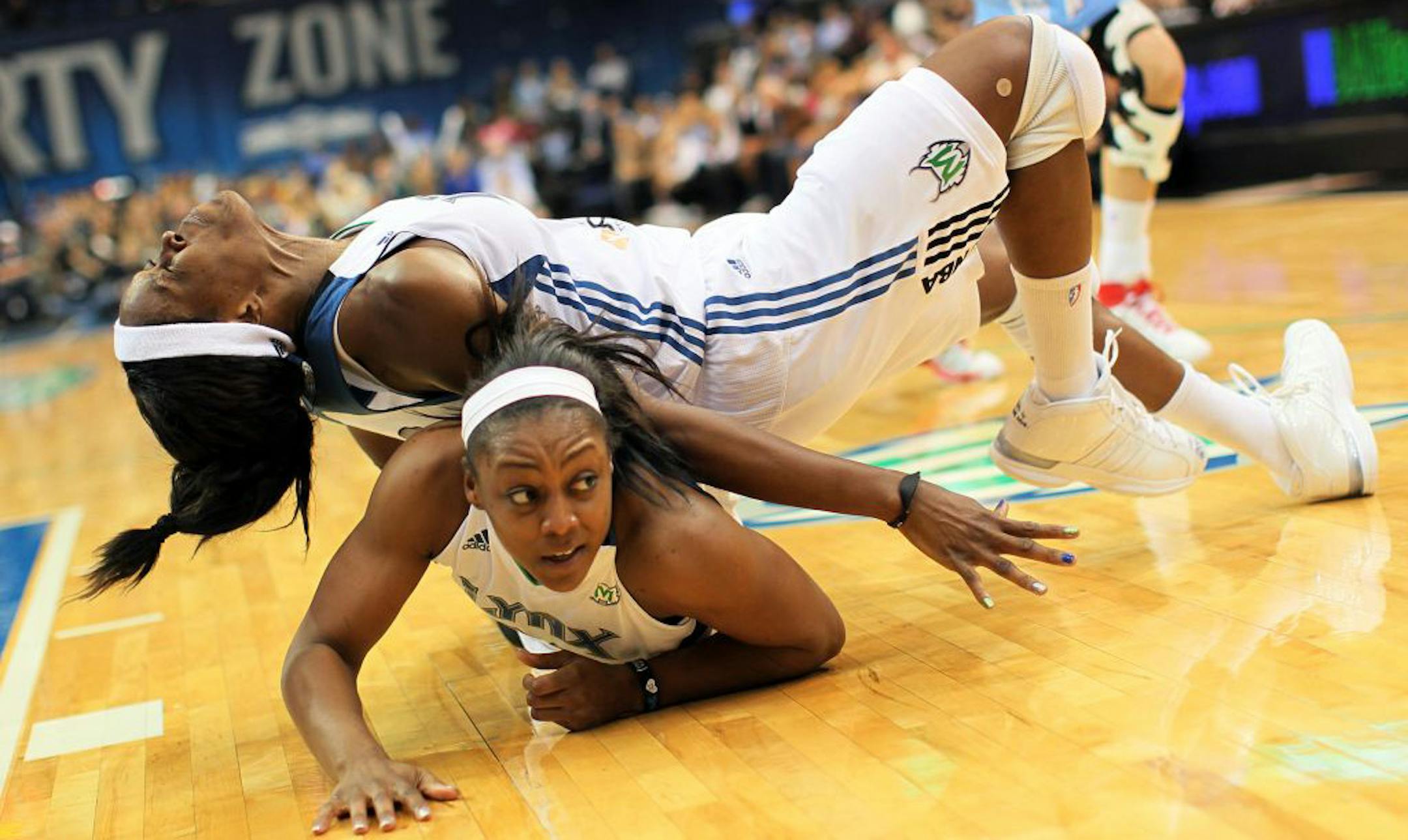 Taj McWilliams-Franklin, top, was injured in a collision with Monica Wright on Wednesday night.