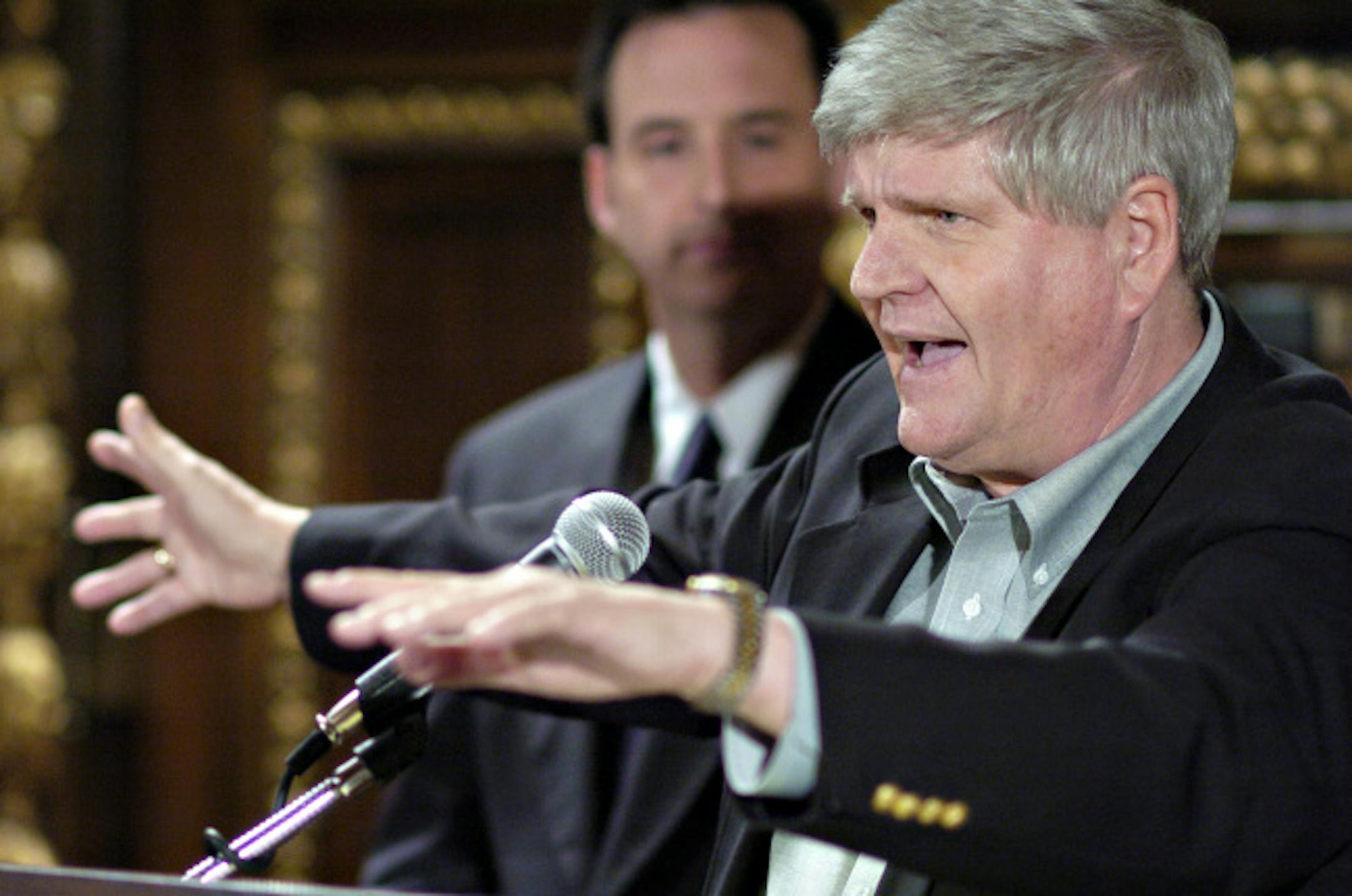 David Brewster/Star Tribune -- Monday_5/17/04_StateCapitol,St.Paul - - - - Sen. Dick Day vented some of his frustration with the recently adjourned legislative session at a press conference called by Gov. Pawlenty (in back ground) who also talked about his views on the session.