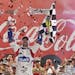 Jimmie Johnson celebrates in Victory Lane after winning the NASCAR Sprint Cup series Coca-Cola 600 auto race at Charlotte Motor Speedway in Concord, N
