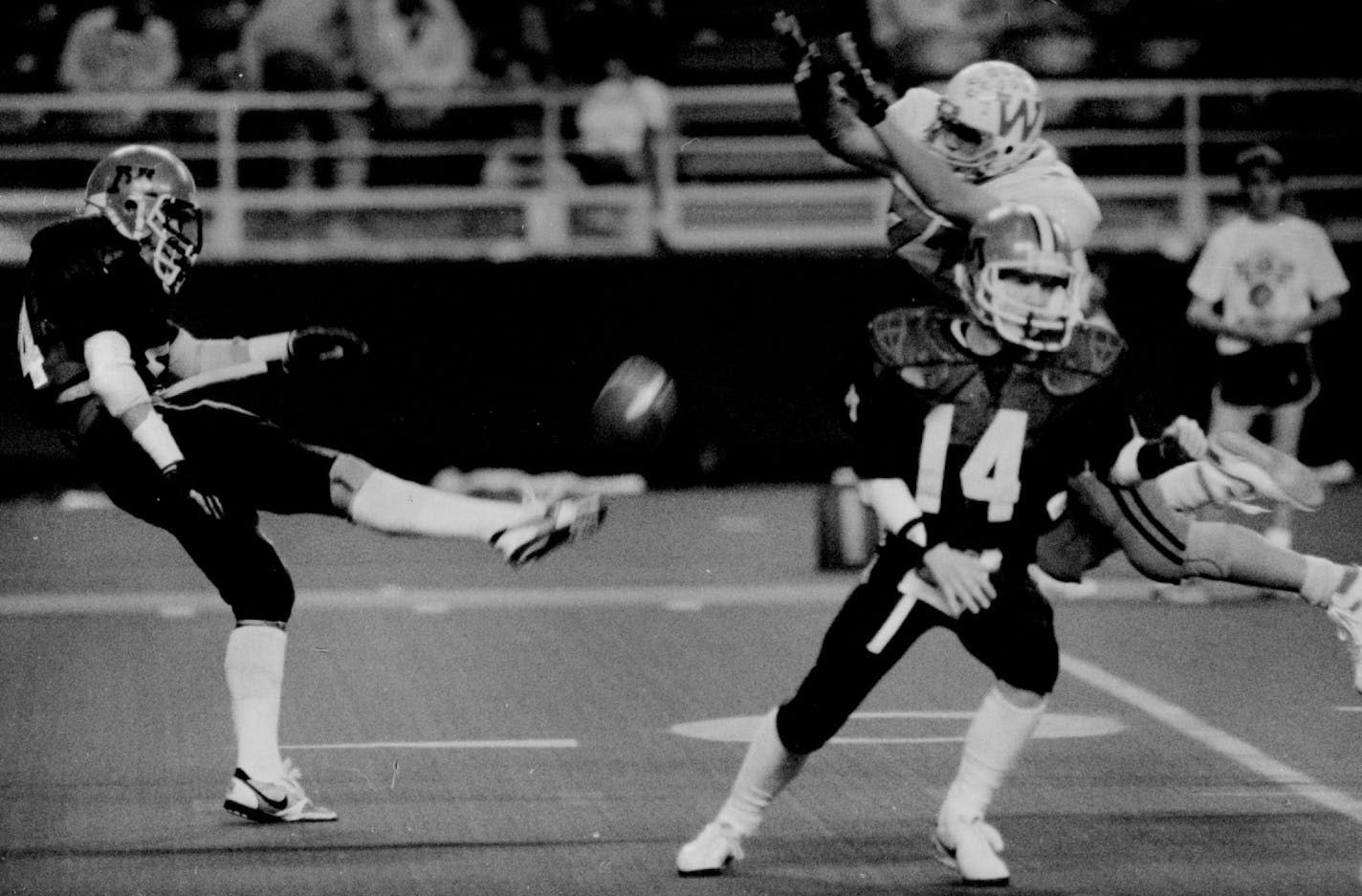 November 29, 1987 Winona's Scott Sether blocks Moorhead's punt in first guarter setting up Winona's first touchdown from inside the 10 yard line. Marlin Levison, Minneapolis Star Tribune