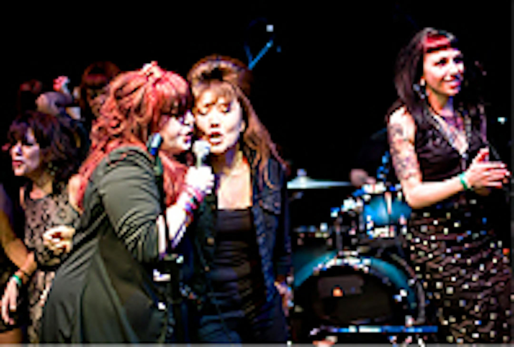 Nikki Corvette, left, played the Girls Got Rhythm Fest in St. Paul last week. She shared the stage for this number with one of the 5.6.7.8's.