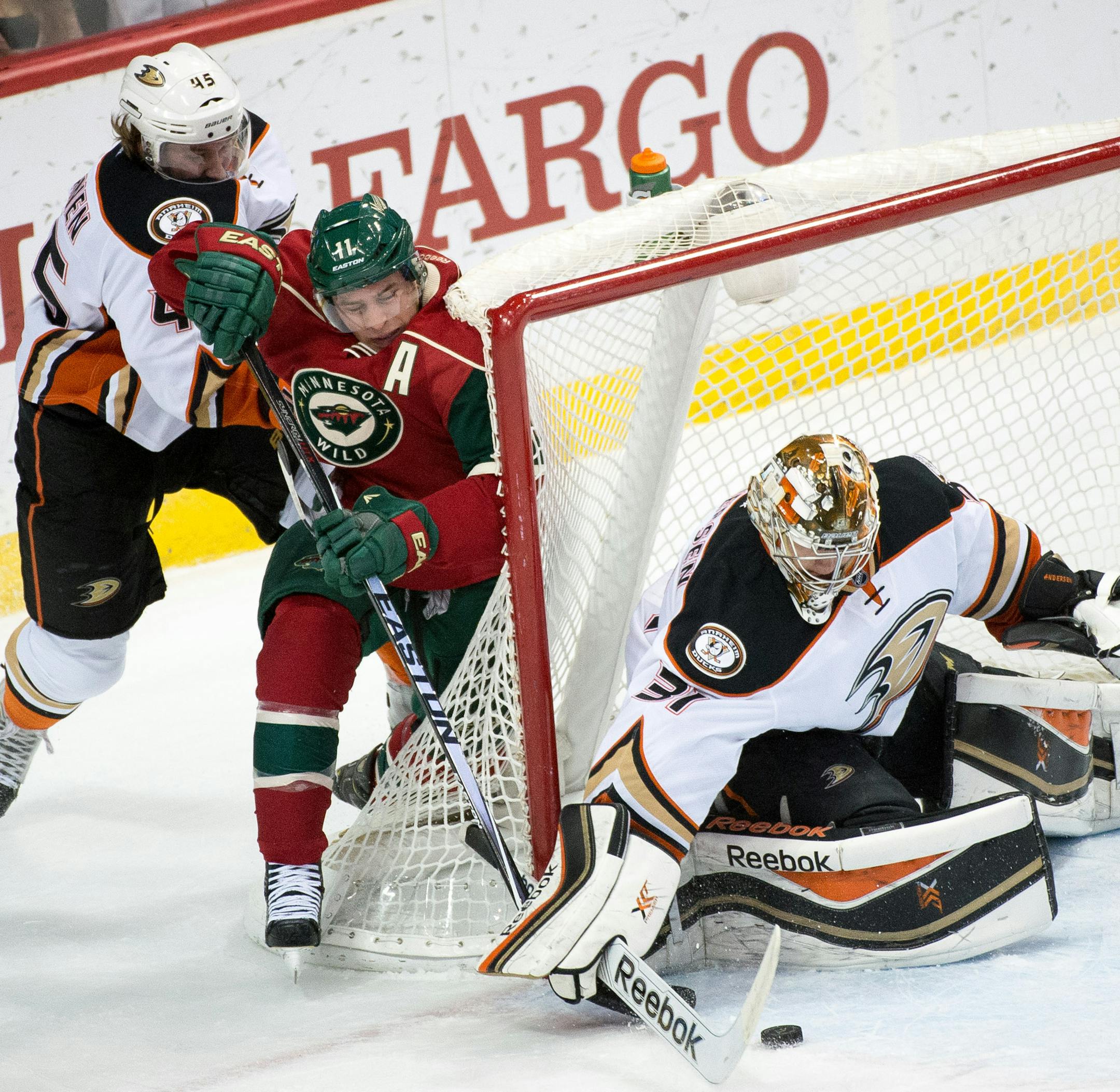 Minnesota Wild left wing Zach Parise (11) attempts a shot from behind the net on Anaheim Ducks goalie Frederik Andersen (31) during the first period Friday. ] AARON LAVINSKY • aaron.lavinsky@startribune.com The Minnesota Wild take on the Anaheim Ducks Friday, Dec. 5, 2014 at Xcel Energy Center in St. Paul.