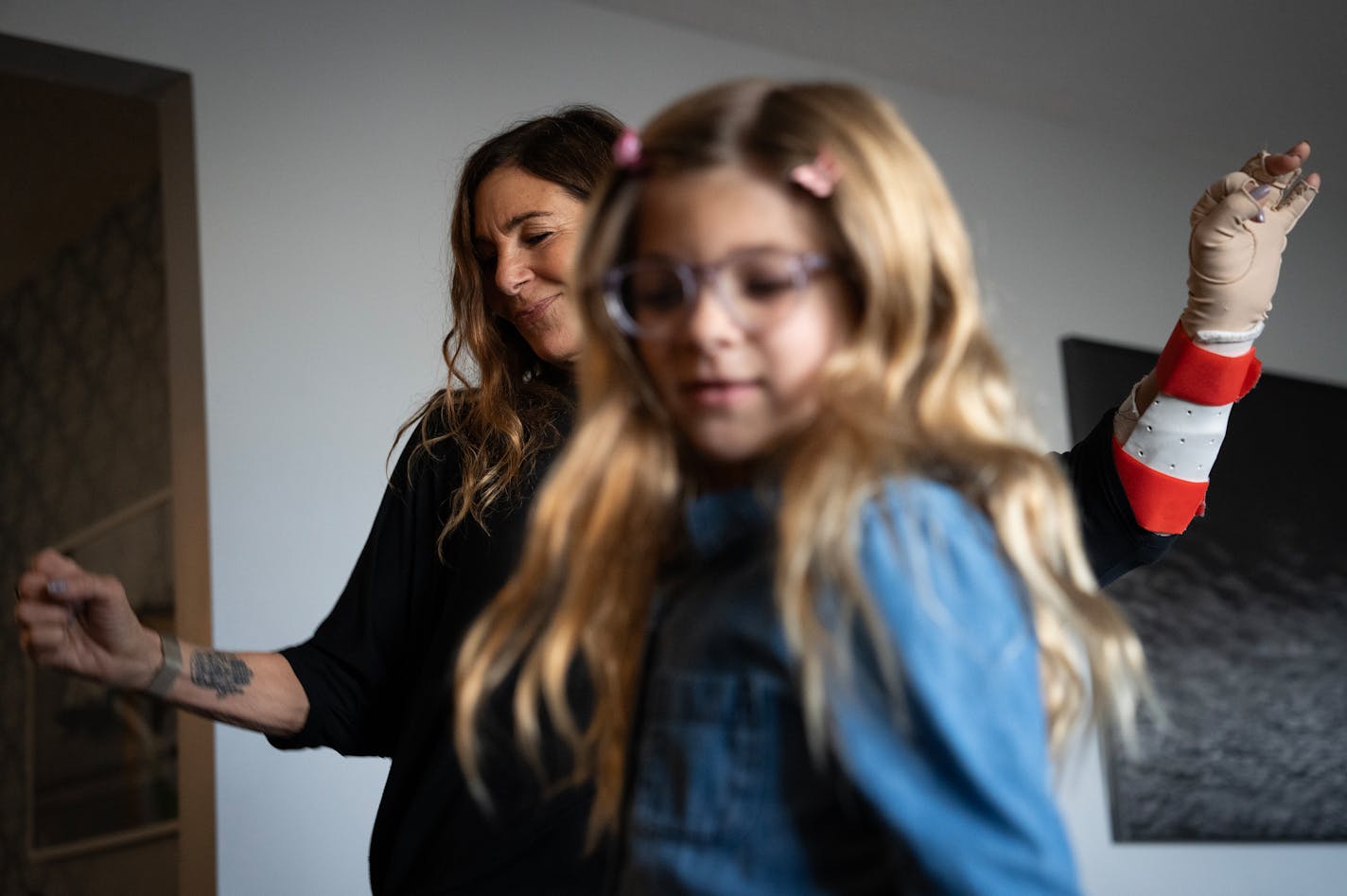 'The Golden Bachelor' contestant Leslie Fhima dances with granddaughter Sophia, 6, inside her home in Minneapolis, Minn., on Saturday, Oct. 28, 2023. ] SHARI L. GROSS • shari.gross@startribune.com