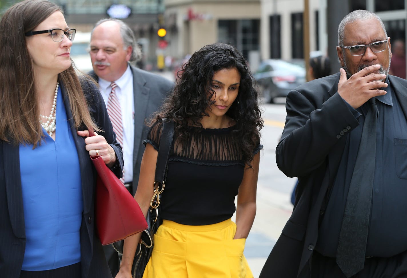 In this file photo, Manuela Testolini, Prince's ex-wife, center, leaves after the court hearing on whether or not to unseal the divorce file in Prince's divorce from Testolini.