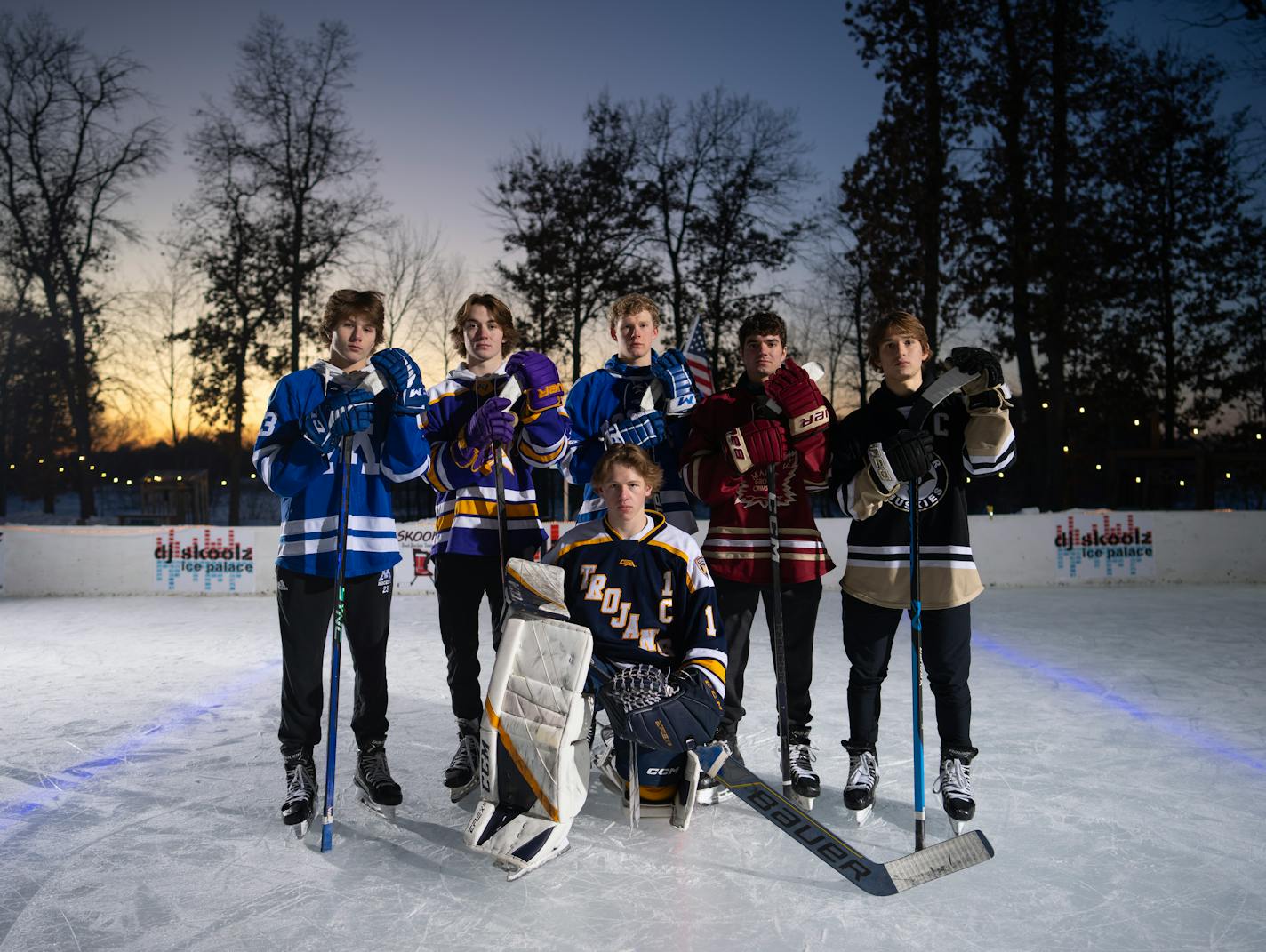 The Star Tribune's All Metro Boys Hockey First Team gathered for a portrait Sunday evening, February 5, 2023 on the backyard rink of Tom Schoolmeesters in Circle Pines, Minn. They are, from left, John Stout of Minnetonka, Jake Fisher of Cretin-Derham Hall, Chase Cheslock of Rogers, Finn Brink of Maple Grove, Gavyn Thoreson of Andover, and goalie Will Ingemann of Wayzata, the Metro Player of the Year. ] JEFF WHEELER • jeff.wheeler@startribune.com