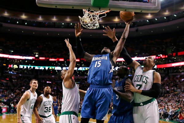 Minnesota Timberwolves forward Shabazz Muhammad (15) puts a shot up against the Boston Celtics during the second half of an NBA basketball game in Bos