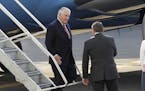 U.S. Secretary of State Rex Tillerson, left, is welcomed by Mauricio Ibarra Ponce de Leon, center, North America director with Mexico's foreign minist