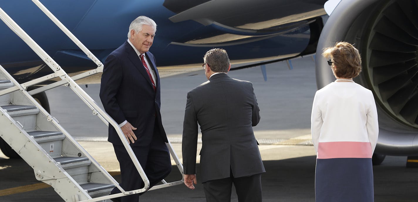 U.S. Secretary of State Rex Tillerson, left, is welcomed by Mauricio Ibarra Ponce de Leon, center, North America director with Mexico's foreign ministry, and U.S. Ambassador to Mexico Roberta Jacobson as he arrives at the airport in Mexico City, Wednesday, Feb. 22, 2017. President Donald Trump has sent Tillerson and Homeland Security Secretary John Kelly to Mexico on a fence-mending mission made all the more challenging by the actual fence he wants to build on the southern border. (AP Photo/Rebe