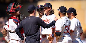 Twins pitching coach Pete Maki has a word with Twins lefthander Kody Funderburk during the eighth inning Sunday, when Boston scored four runs off the 