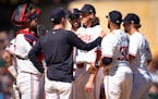 Twins pitching coach Pete Maki has a word with Twins lefthander Kody Funderburk during the eighth inning Sunday, when Boston scored four runs off the 