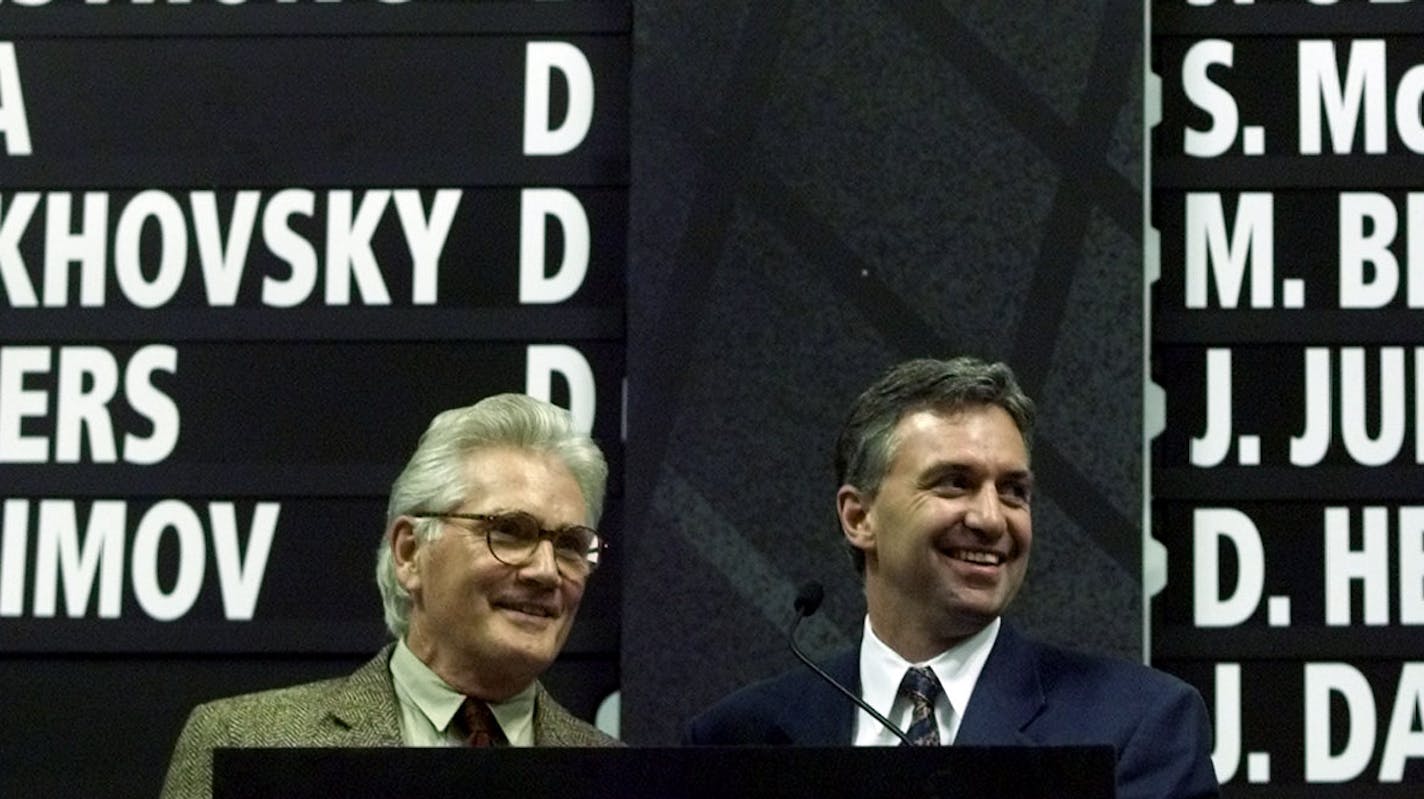 Day 1 of 4 Heads up on Wild NHL draft June 23, 2000 -- Minnesota Wild Executive Vice President/General Manager Doug Risebrough and Chairman Robert O. Naegele, Jr. crack a smile after the announcement of their picks during the NHL Expansion Draft held on Friday afternoon at The Canadian Airlines Saddledome in Calgary, Canada.