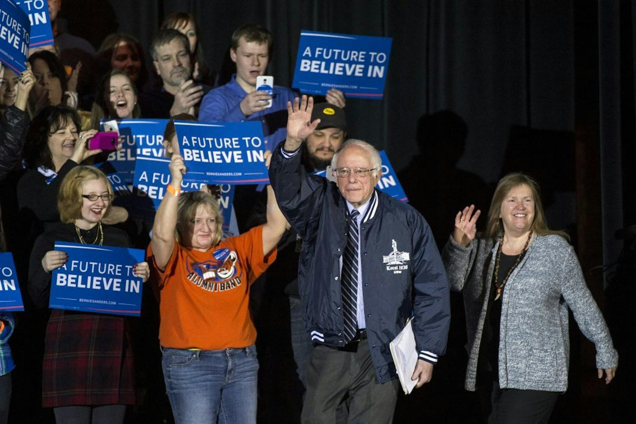 Democratic presidential candidate Bernie Sanders waved at an audience of hundreds at Hibbing High School as he arrived on stage Friday morning.