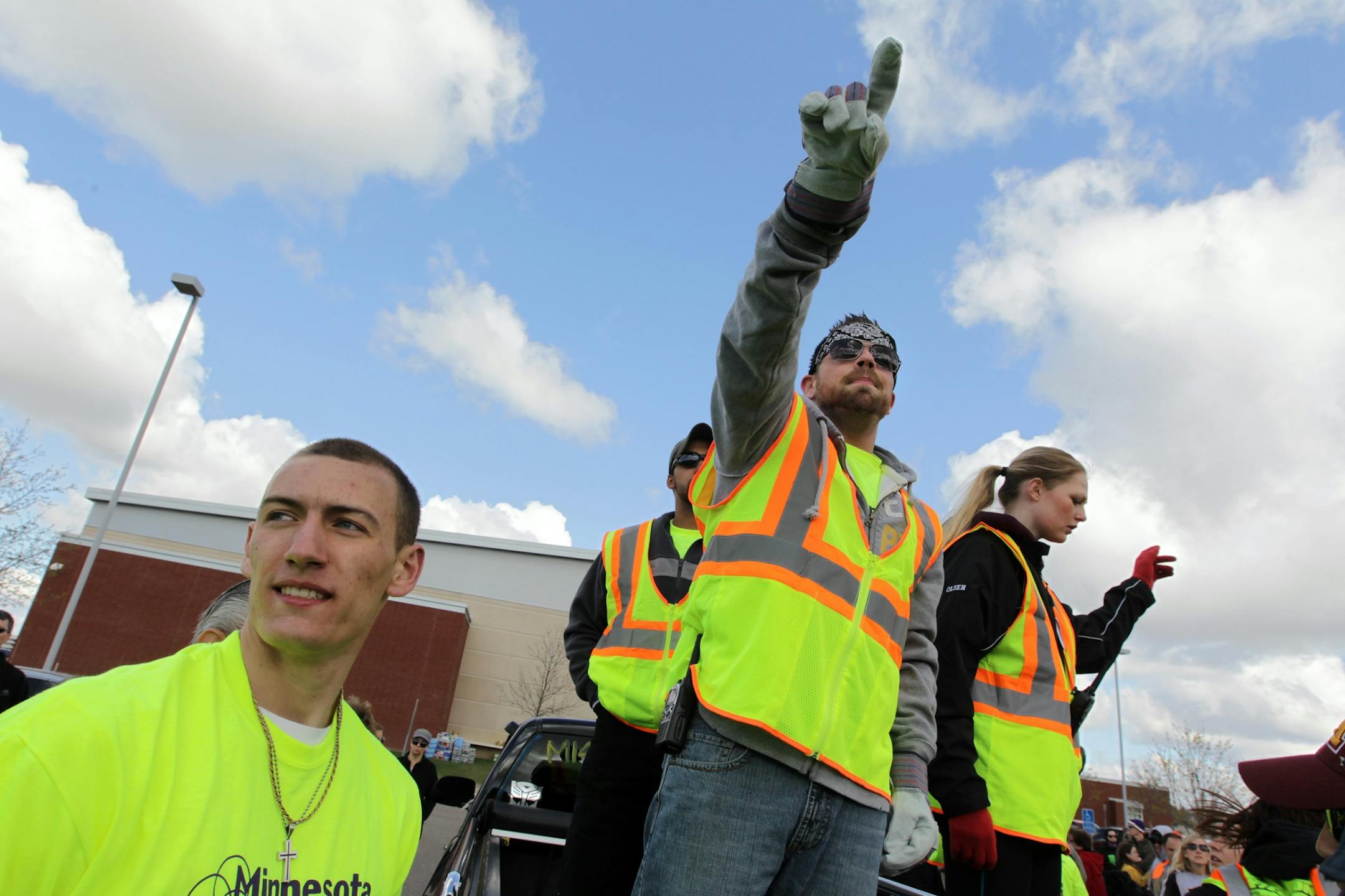 Josh Truax points as he splits a crowd of hundreds up into groups before the search for missing 24-year-old Mandy Matula in Victoria May 11, 2013. Mandy's brother Steven Matula, left, organized several searches in Eden Prairie and Carver County via Facebook.