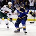 St. Louis Blues' Vladimir Tarasenko, right, of Russia, celebrates after scoring as Minnesota Wild's Mikael Granlund, left, of Finland, watches during 