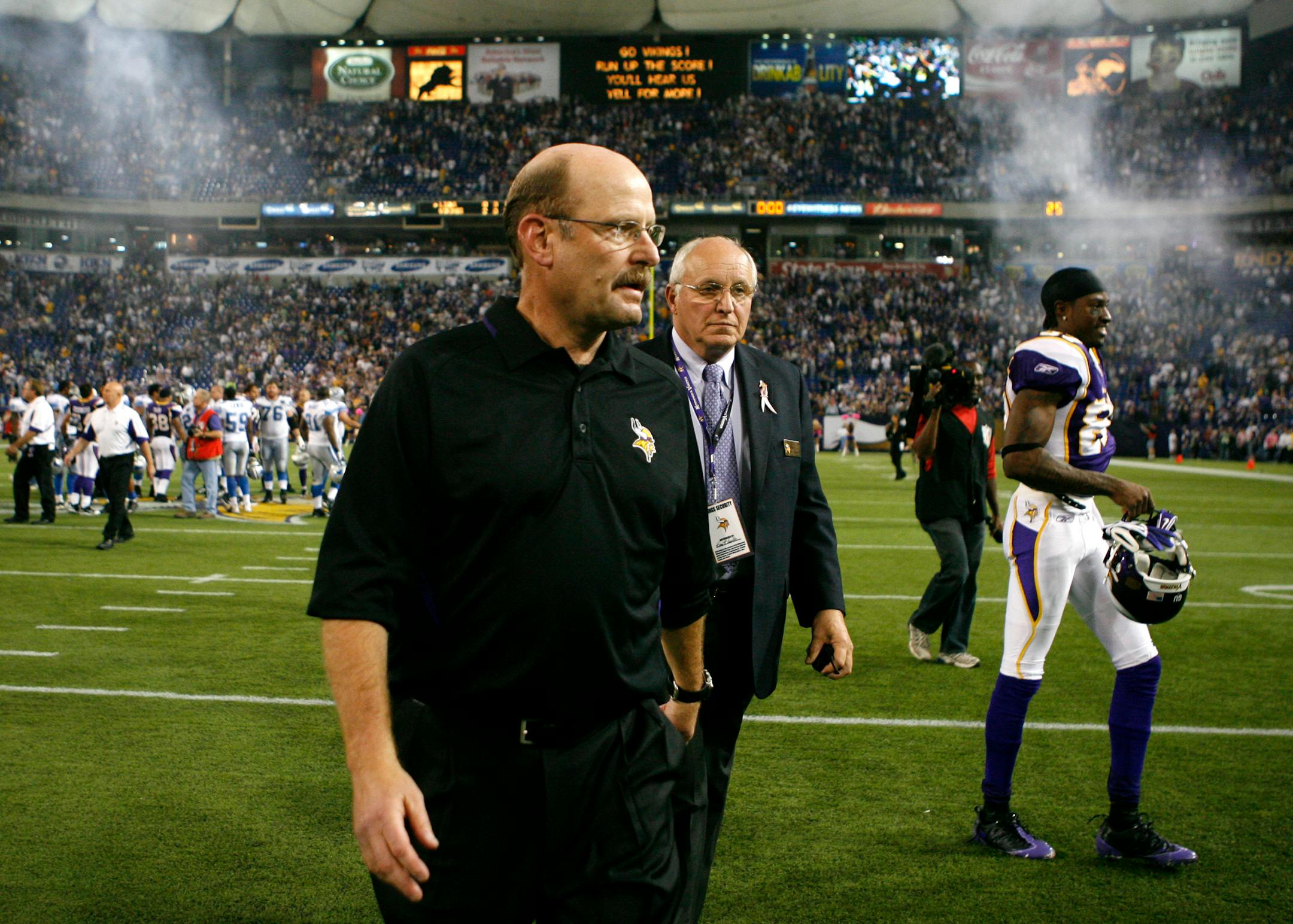 Vikings' head coach Brad Childress' team narrowly escaped with a 12-10 win over Detroit at the Metrodome as he left the field next to one of the Vikings' stars -- Bernard Berrian, right.