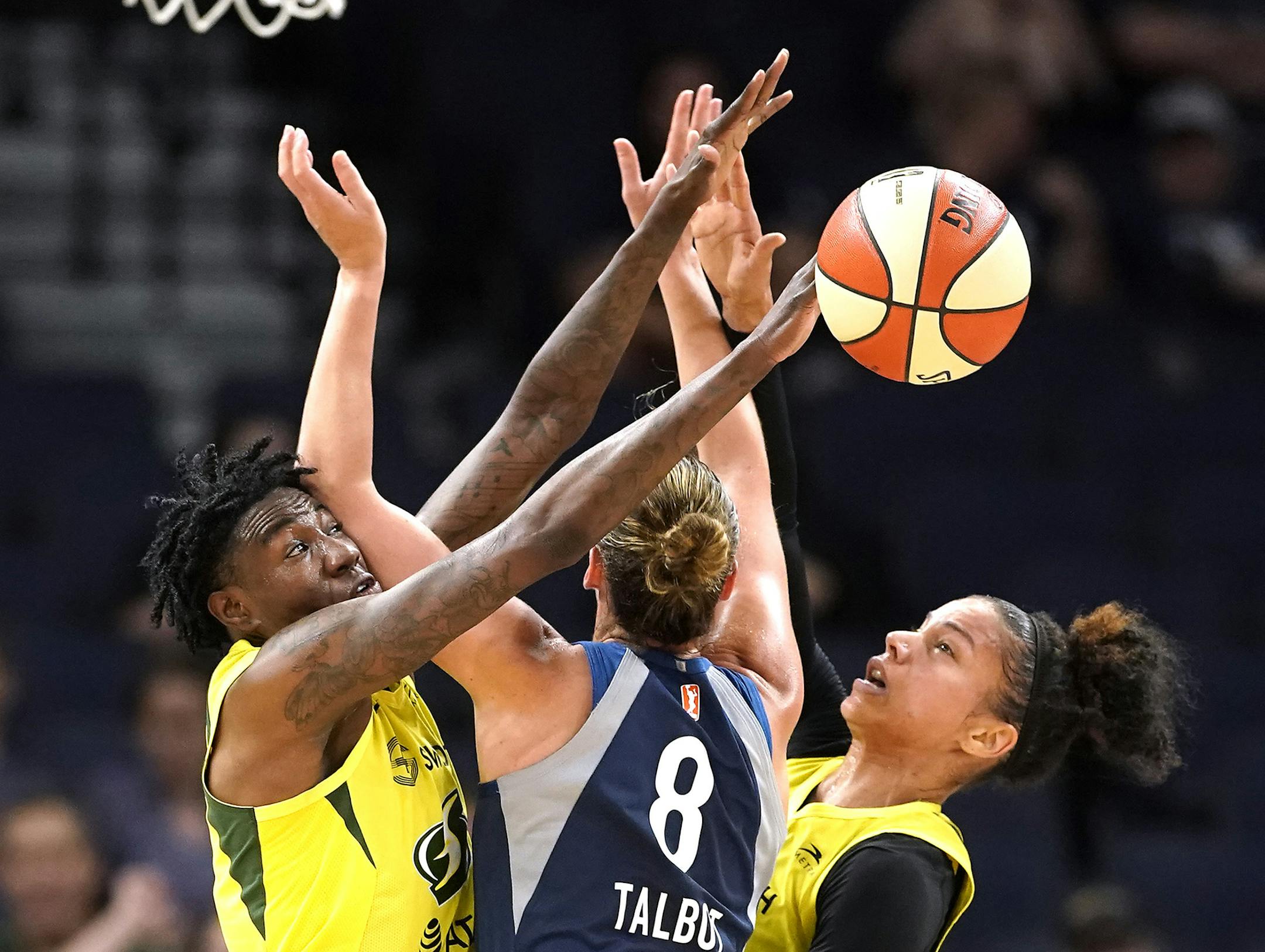Seattle Storm forward Natasha Howard (6), from left, Minnesota Lynx forward Stephanie Talbot (8) and Seattle Storm forward Alysha Clark (32) battle for the ball during the second half. ] LEILA NAVIDI • leila.navidi@startribune.com BACKGROUND INFORMATION: The Minnesota Lynx play against the Seattle Storm at Target Center in Minneapolis on Wednesday, July 17, 2019. The Seattle Storm won the game 90-79.
