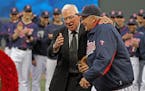 Former Twins manager Tom Kelly, left, laughed with Twins bullpen coach Rick Stelmaszek after Kelly tossed him a ceremonial pitch during the pregame ce