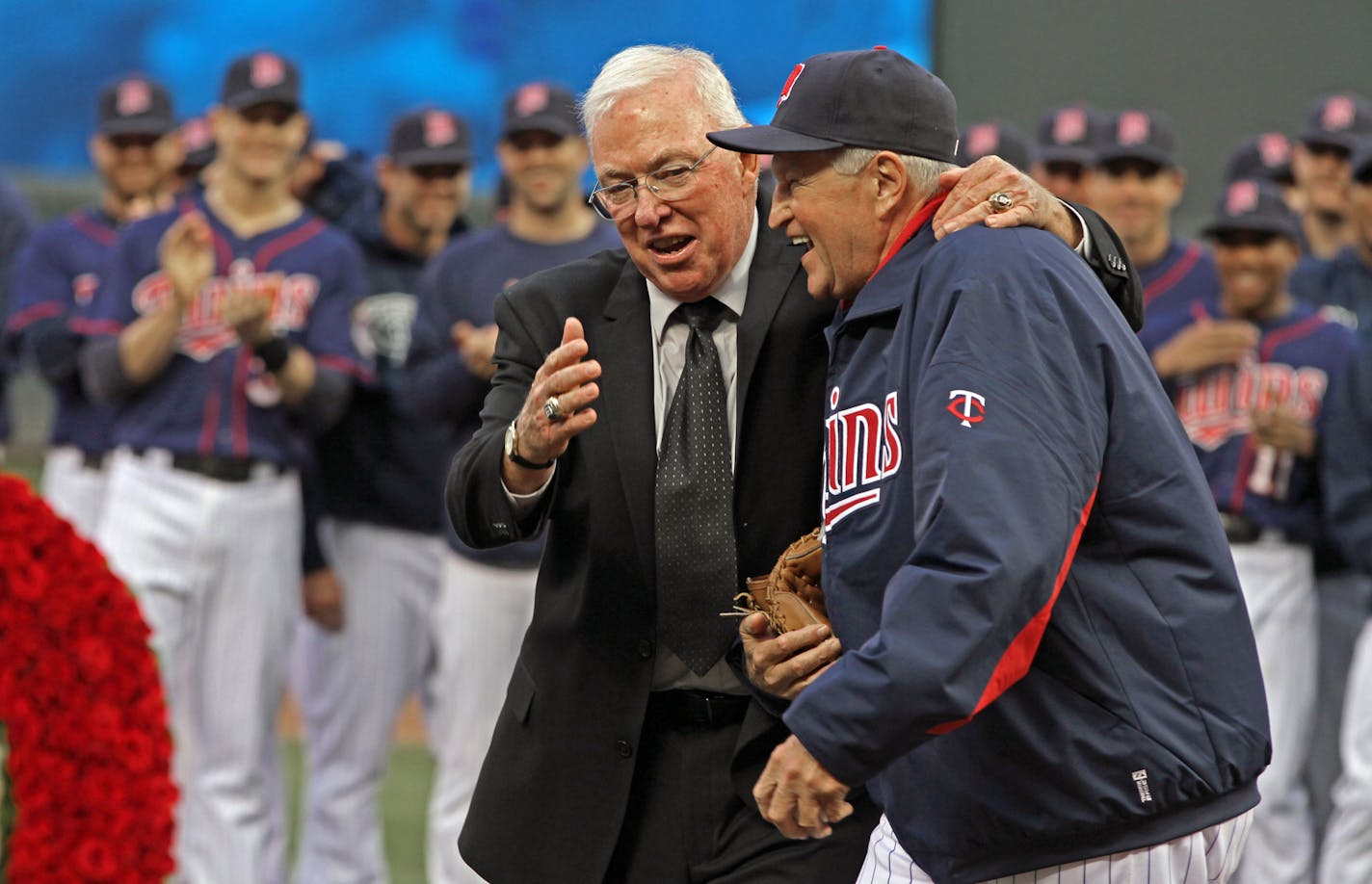 Former Twins manager Tom Kelly, left, laughed with Twins bullpen coach Rick Stelmaszek after Kelly tossed him a ceremonial pitch during the pregame ceremony at Target Field to retire the former manager's No. 10 in September of 2012.