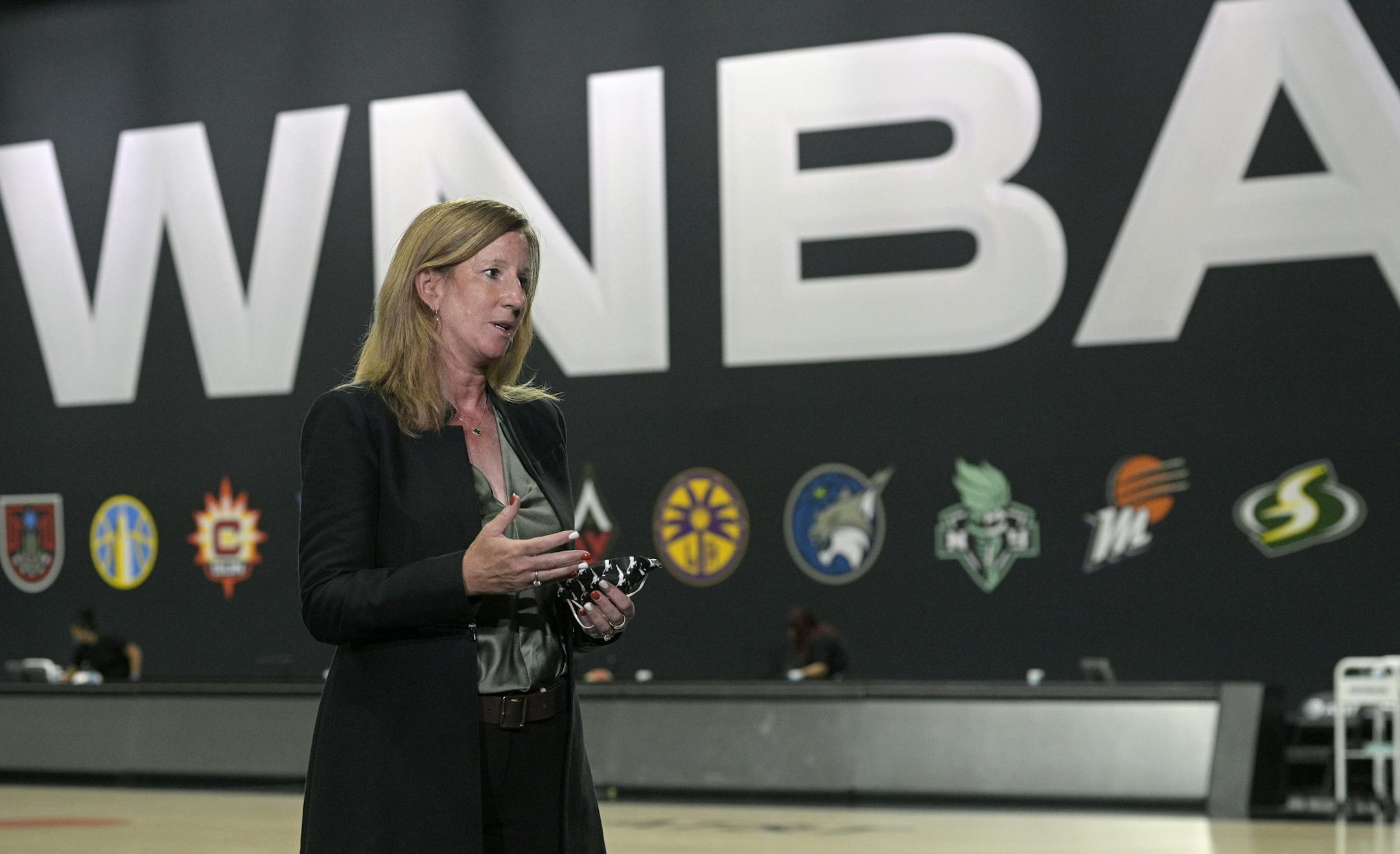 WNBA Commissioner Cathy Engelbert answers questions about a postponed game between the Seattle Storm and the Minnesota Lynx after Game 1 of a WNBA basketball semifinal round playoff game between the Connecticut Sun and the Las Vegas Aces, Sunday, Sept. 20, 2020, in Bradenton, Fla. (AP Photo/Phelan M. Ebenhack)