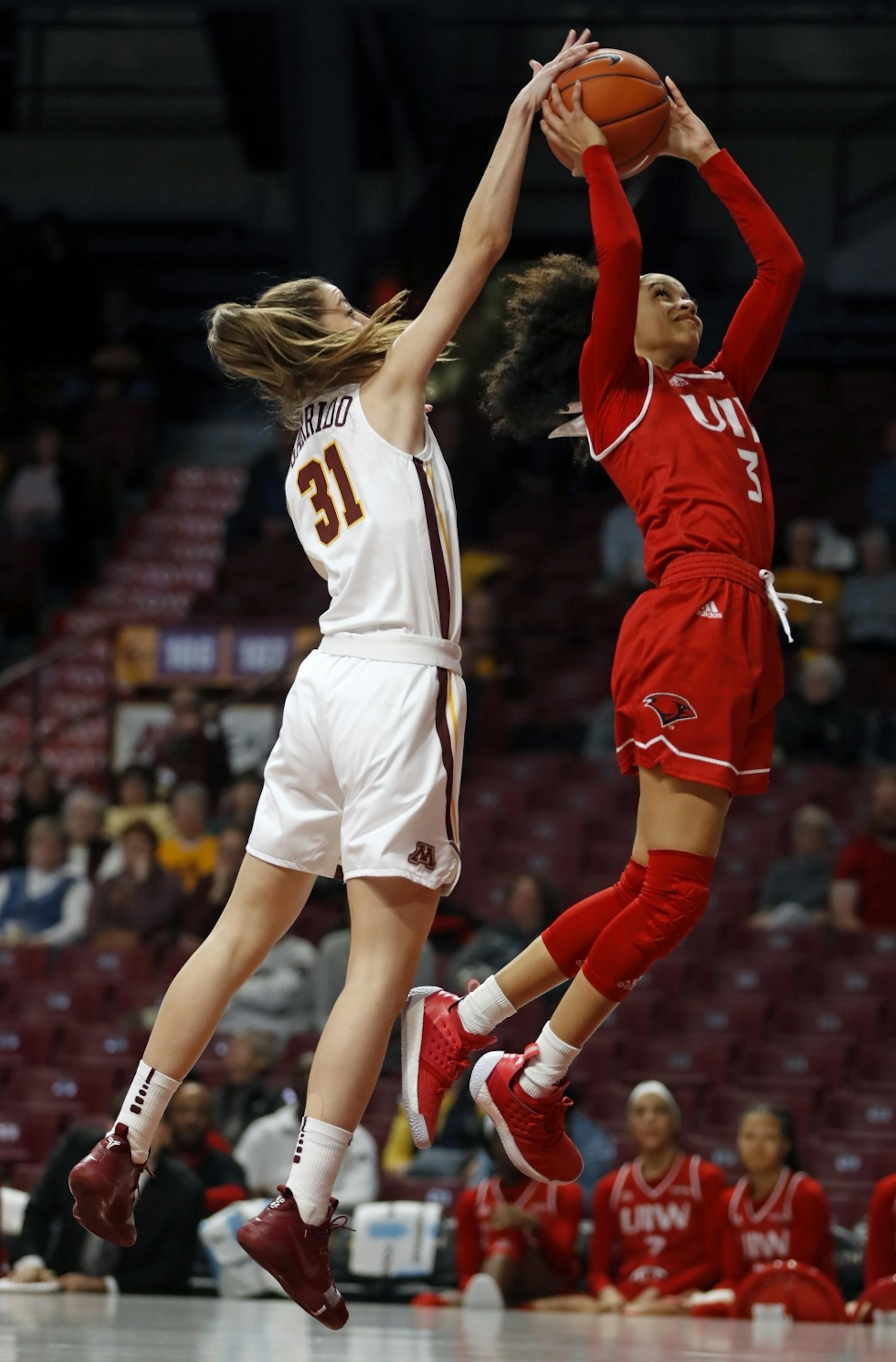 Irene Garrido Perez(31) blocks a shot by Aleandra Busby-Leija.