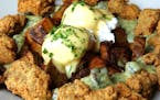 Poached eggs, Hollandaise, hash browns and cornmeal crusted oysters at Elizabeth's Restaurant. MUST CREDIT: Photo by Nevin Martell for The Washington 