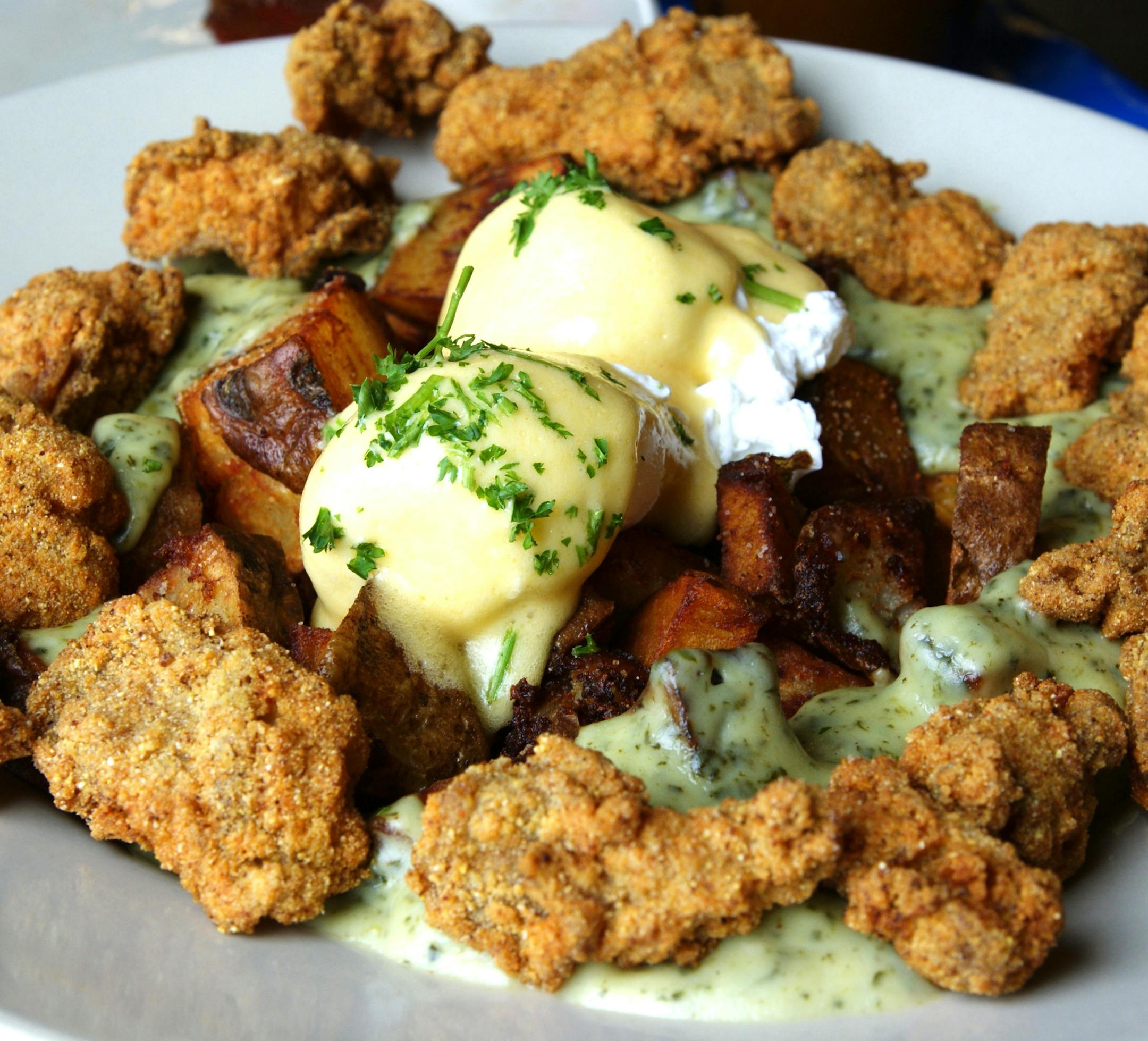 Poached eggs, Hollandaise, hash browns and cornmeal crusted oysters at Elizabeth's Restaurant. MUST CREDIT: Photo by Nevin Martell for The Washington Post.