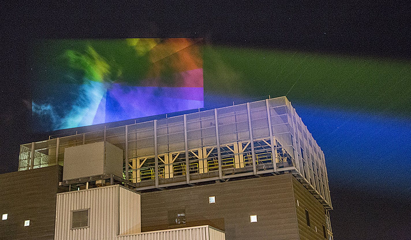 Last summer, the team of artists did a test run and projected lights onto the steam plume at District Energy in St. Paul. (Photo by Aaron Dysart)