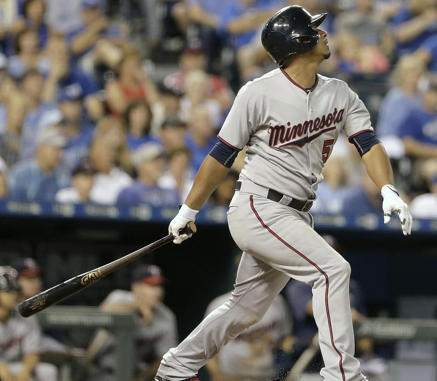 Minnesota Twins' Eduardo Escobar hits a two-run single during the seventh inning of a baseball game against the Kansas City Royals, Monday, Sept. 7, 2015, in Kansas City, Mo. (AP Photo/Charlie Riedel)