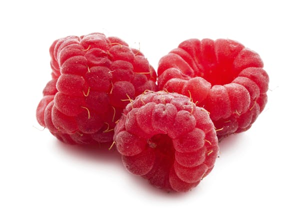 Ripe red raspberries isolated on white background. From istock