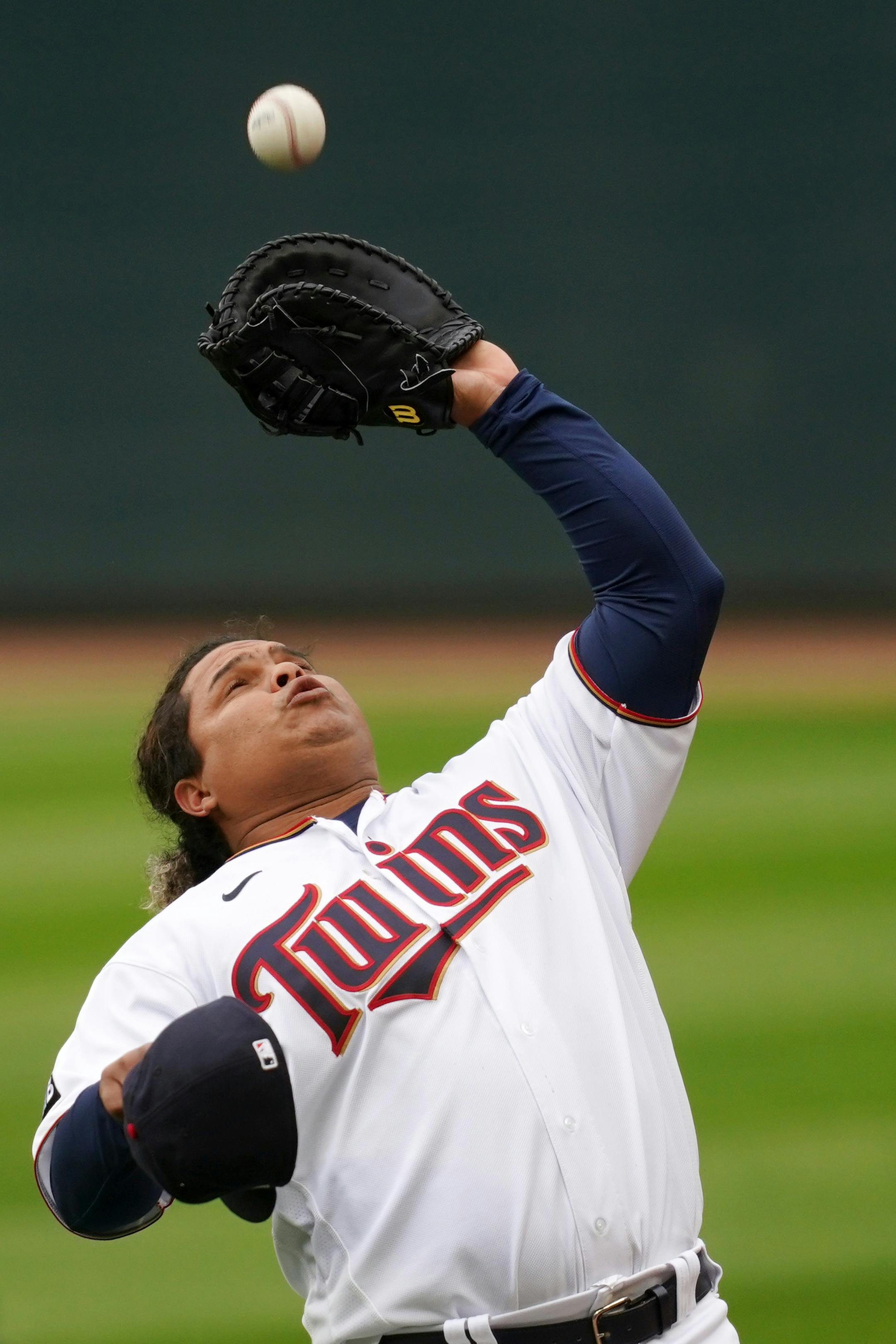 Minnesota Twins first baseman Willians Astudillo (64) caught a pop fly hit by Boston Red Sox catcher Kevin Plawecki (25) in the seventh inning.