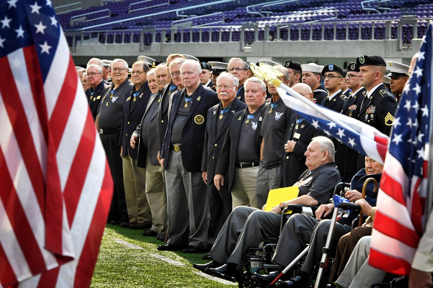 Patriot Guard Riders held flags providing a path for Medal of Honor recipients to take the stage. Over 30 Medal of Honor recipients gathered at U.S. Bank Stadium for a ceremony marking the beginning of the Medal of Honor convention in the Twin Cities.