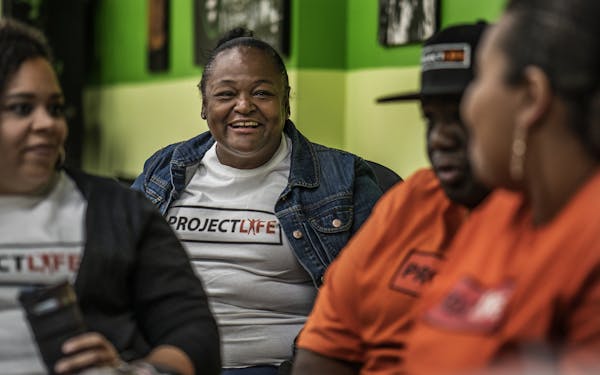Salesha Beeks, whose mother was shot to death a couple years ago in north Minneapolis listened with hope at ideas to help reduce the cycle of violence