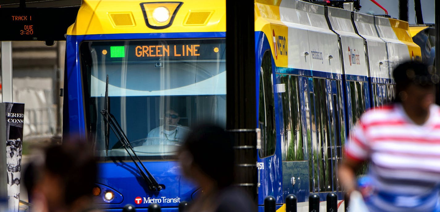 Passengers get on and off the light rail at the Capitol / Rice Street Station, Green Line light rail in St. Paul.