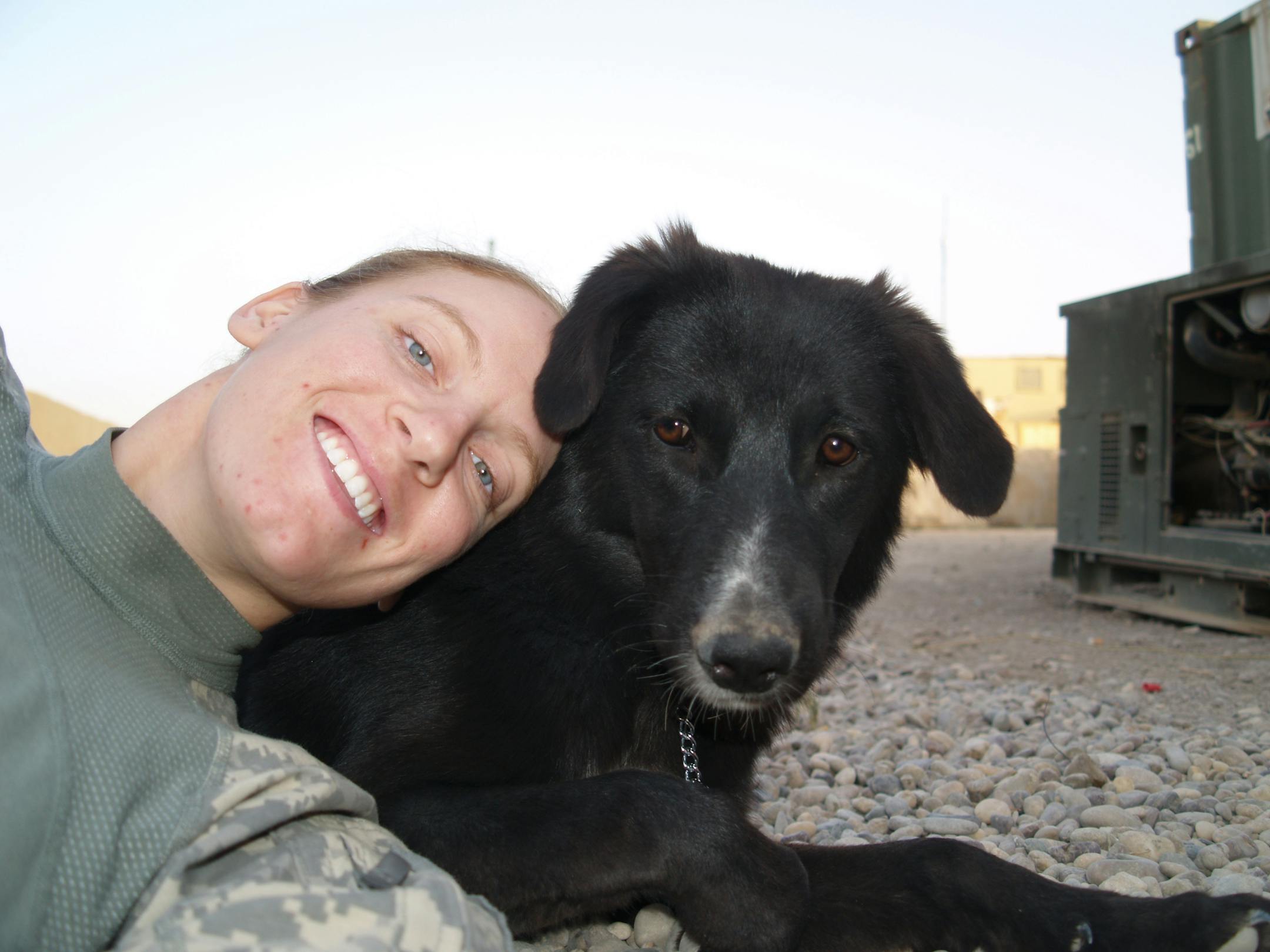 Spc. Gwen Beberg with Ratchet in Iraq