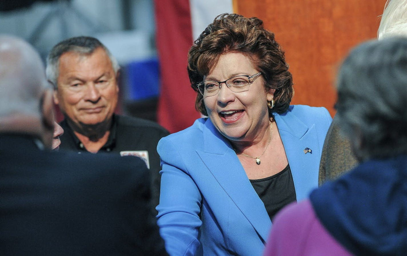 Republican state Sen. Carla Nelson, of Rochester, mingles with supporters after announcing her candidacy for the 1st Congressional District seat, Monday, Oct. 2, 2017, at Textile Care Services in Rochester, Minn. (Joe Ahlquist/The Rochester Post-Bulletin via AP)