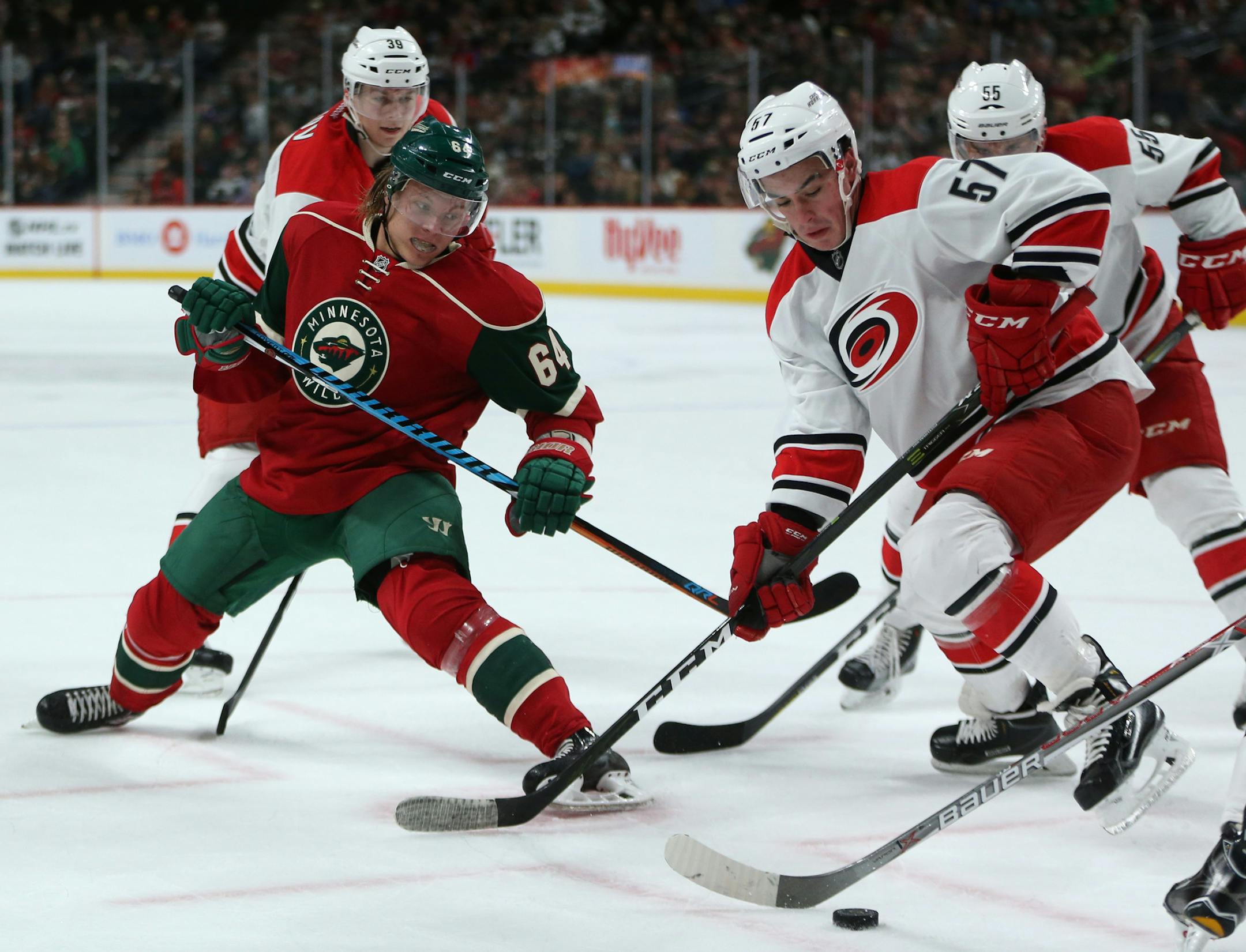 Wild center Mikael Granlund battled Hurricanes center Andrew Poturalski for the puck during the first period. ] Mark Vancleave - mark.vancleave@startribune.com * The Carolina Hurricanes played the Minnesota Wild on Sunday, Oct. 2, 2016 at the Xcel Energy Center in St. Paul, Minn.