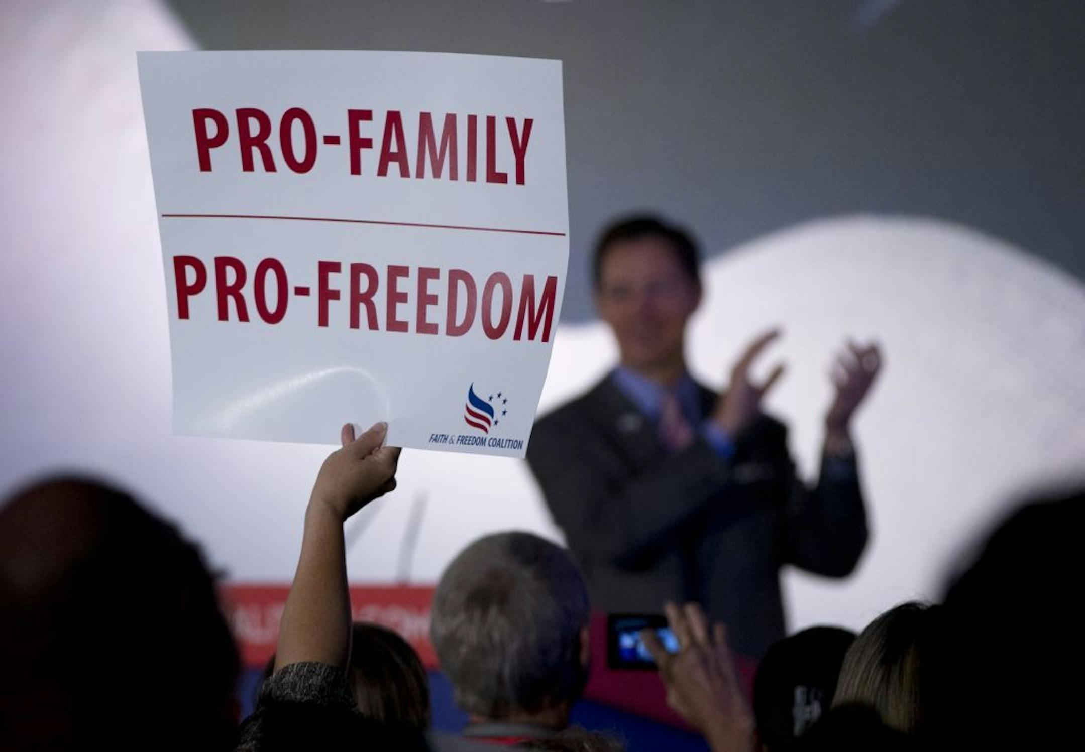 A member of the audience holds up a sing that reads "PRO-FAMILY PRO-FREEDOM" during the Faith and Freedom Coalition Road to Majority 2013 conference, Saturday, June 15, 2013, in Washington.