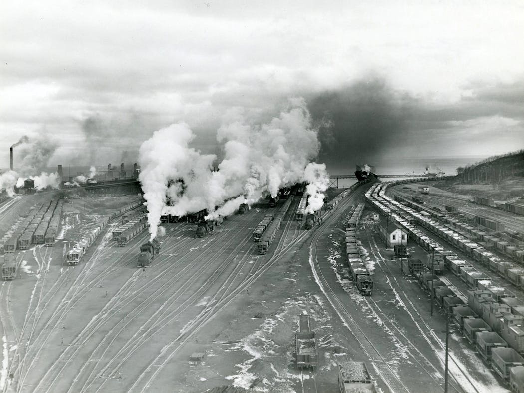 Steam was used to free frozen ore from trains, as shown in this photograph of a rail yard in Two Harbors. This photo was taken between 1930 and 1945.